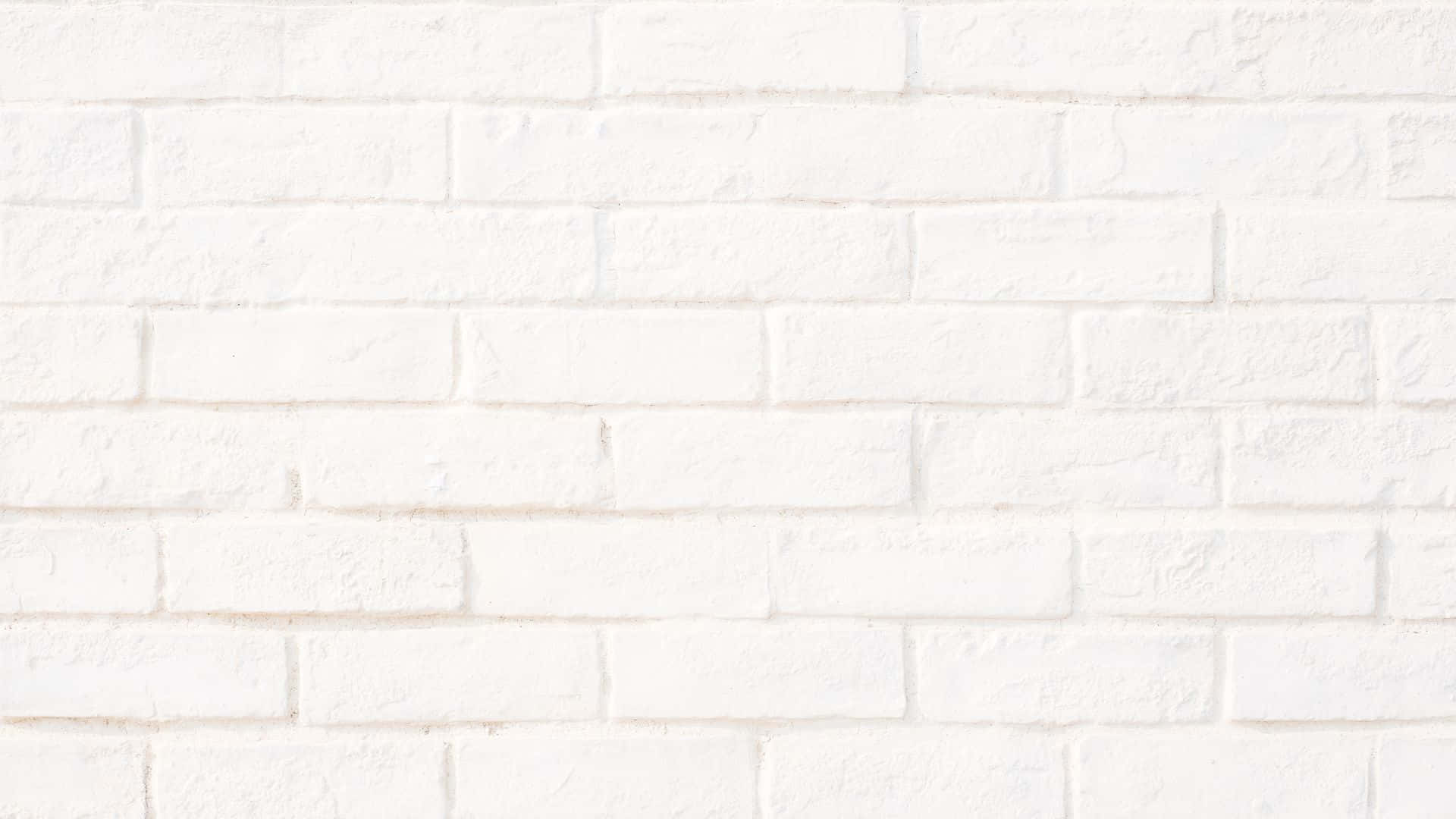 White Brick 桌布 壁紙 — 在柔和均勻的光線下，一面乾淨的白色磚牆，帶有細微紋理和砂漿線。