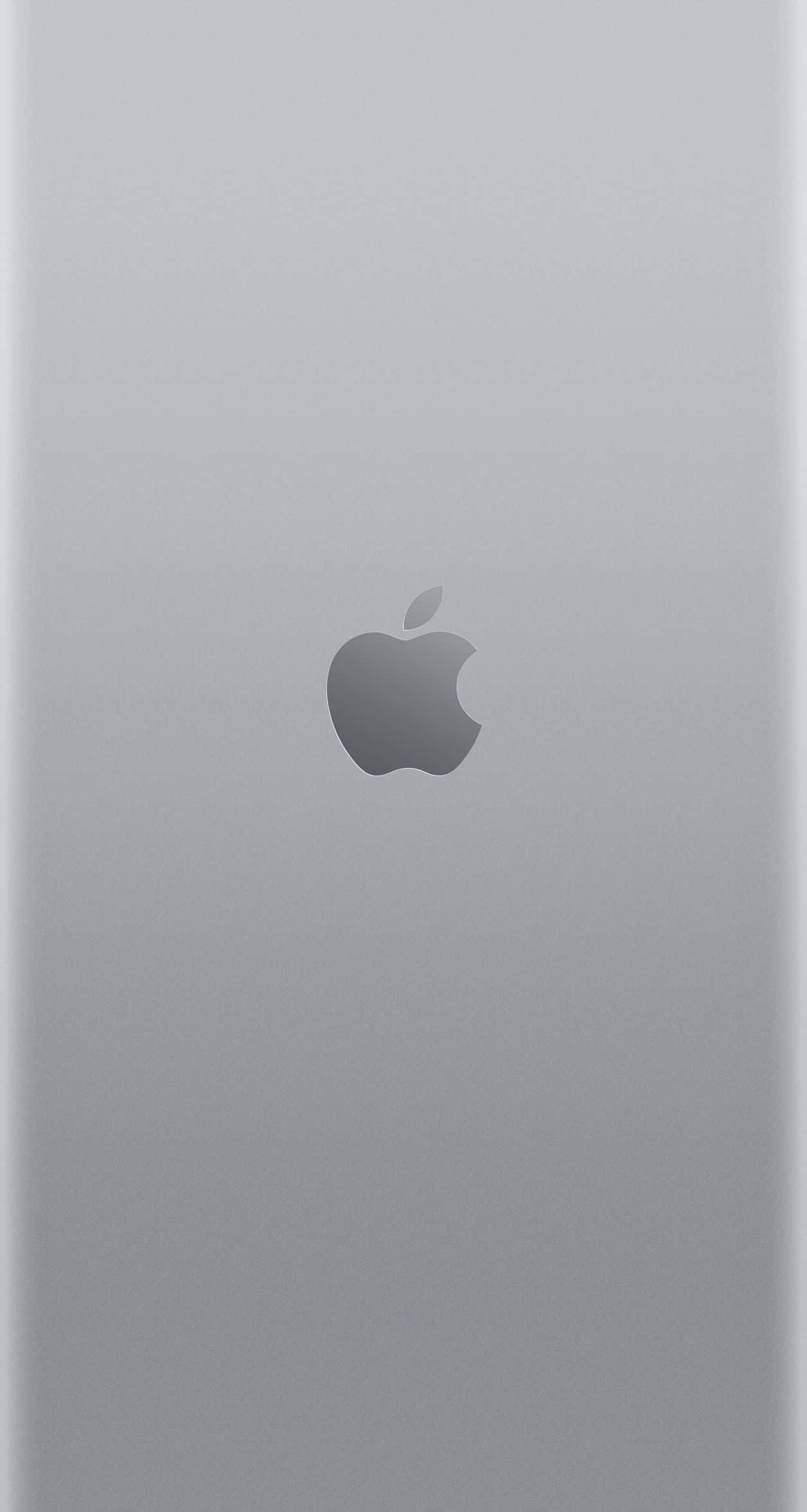iPhone X Apple Logo 桌布 壁紙 — 在柔和環境光下，中央帶有 Apple 標誌的簡約銀色 iPhone 背面。