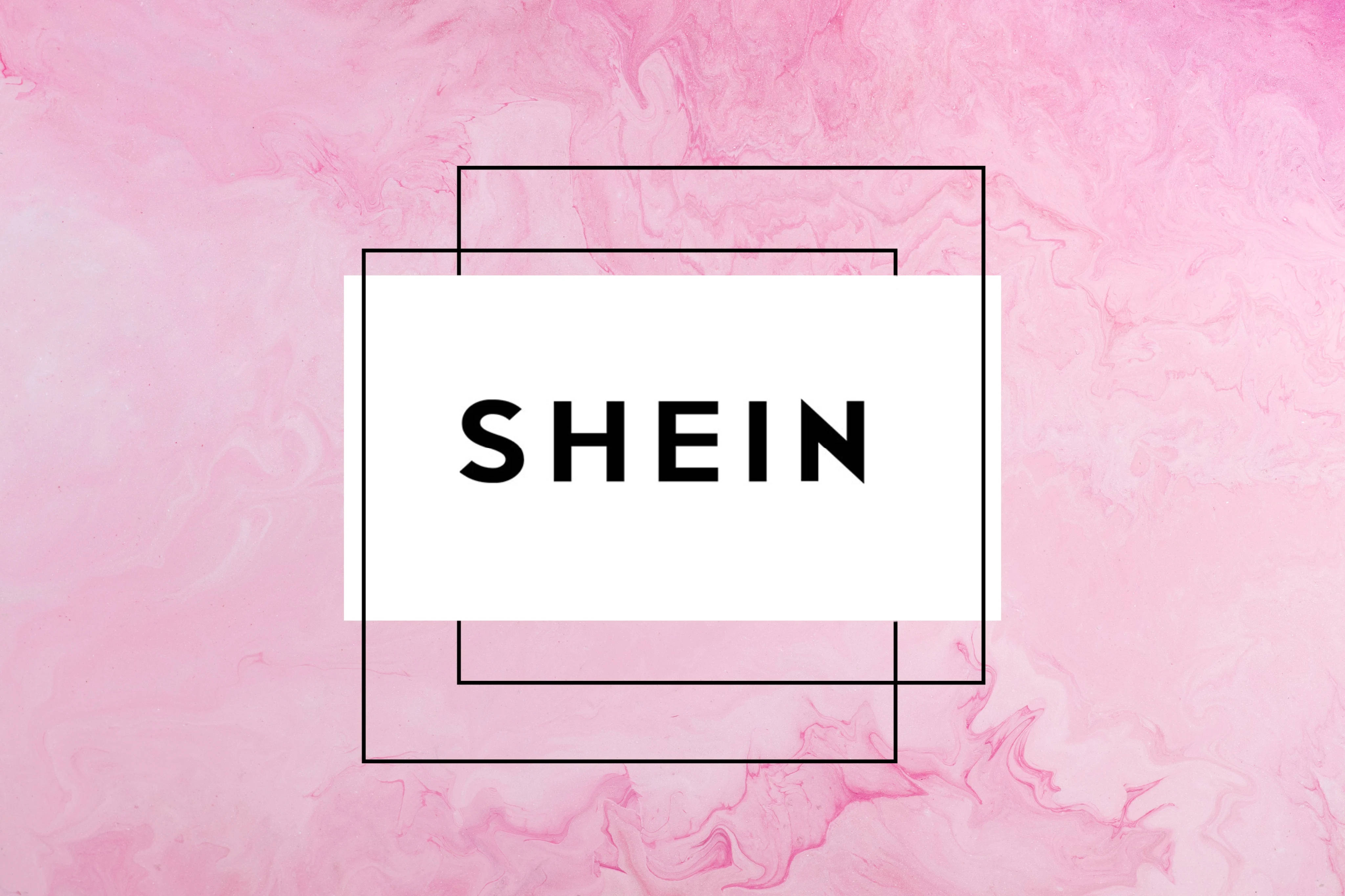 Shein 桌布 壁紙 — 在柔軟粉紅大理石背景上，白色矩形中央有粗體黑色「SHEIN」文字，矩形由重疊的黑色線條框住。