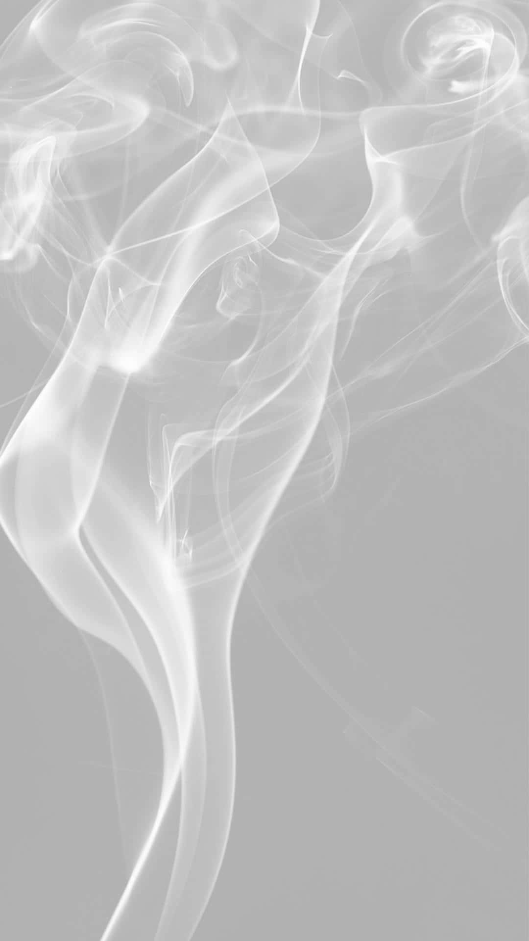 美學 桌布 壁紙 — 在極簡抽象構圖中，空靈的白煙在柔和的灰色背景上優雅地旋轉。