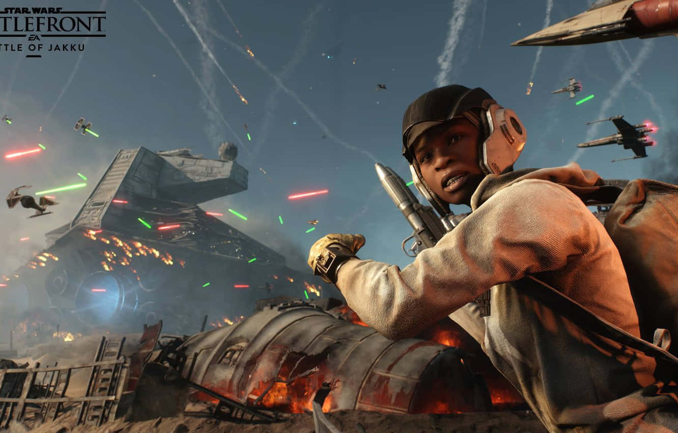 Jakku 桌布 壁紙 — 在沙漠戰場上，一名士兵發射爆能槍，而星際戰機在頭頂爆炸，這是星際大戰的一場戰鬥。