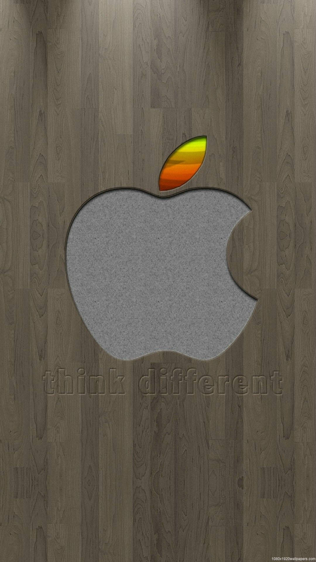 Art iPhone 桌布 壁紙 — 在深色木紋背景上，灰色布料剪出的簡約Apple標誌，帶有漸變葉子。
