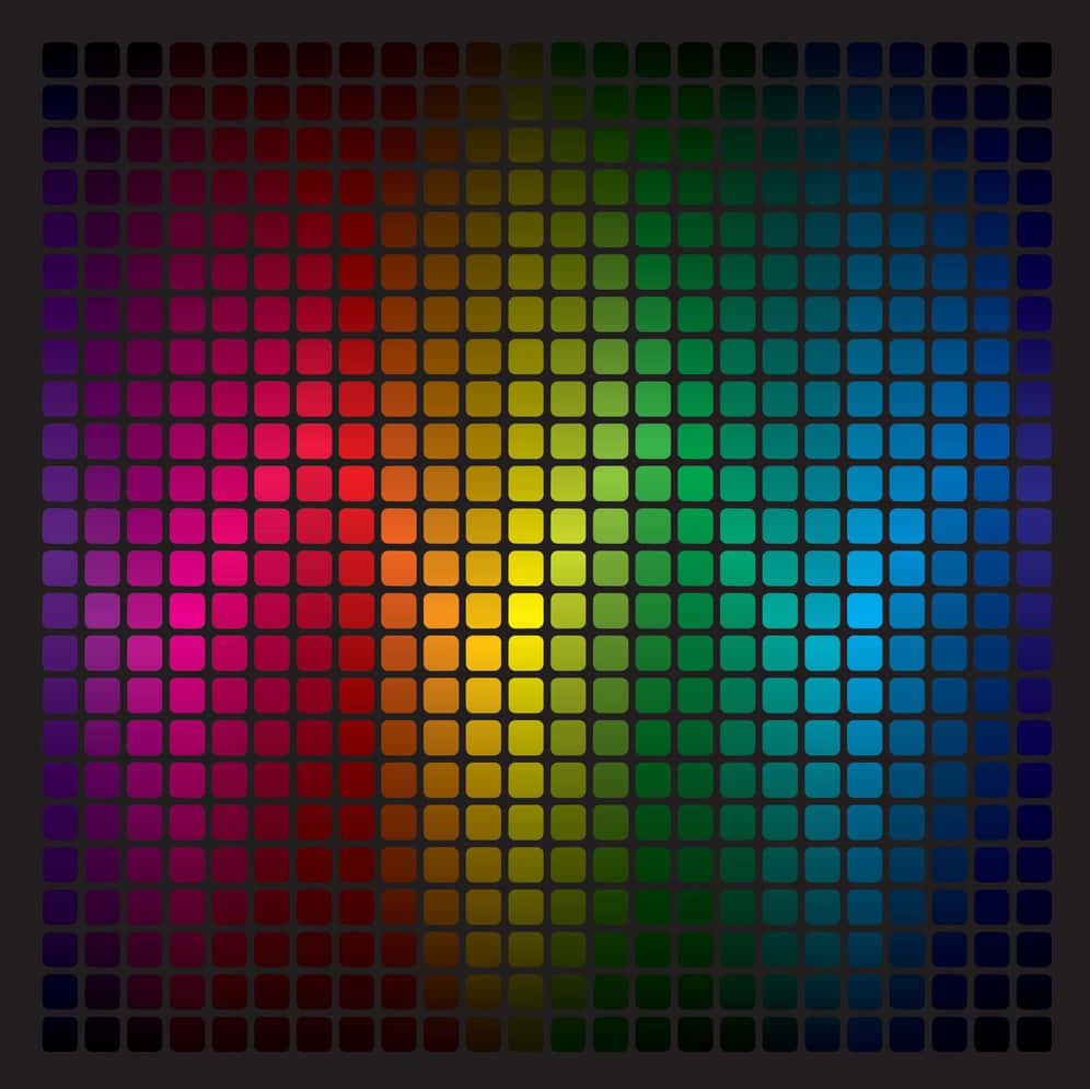 Spectrum 桌布 壁紙 — 在深色背景上，以精確的網格圖案排列的發光方形瓷磚呈現出充滿活力的彩虹色漸變。