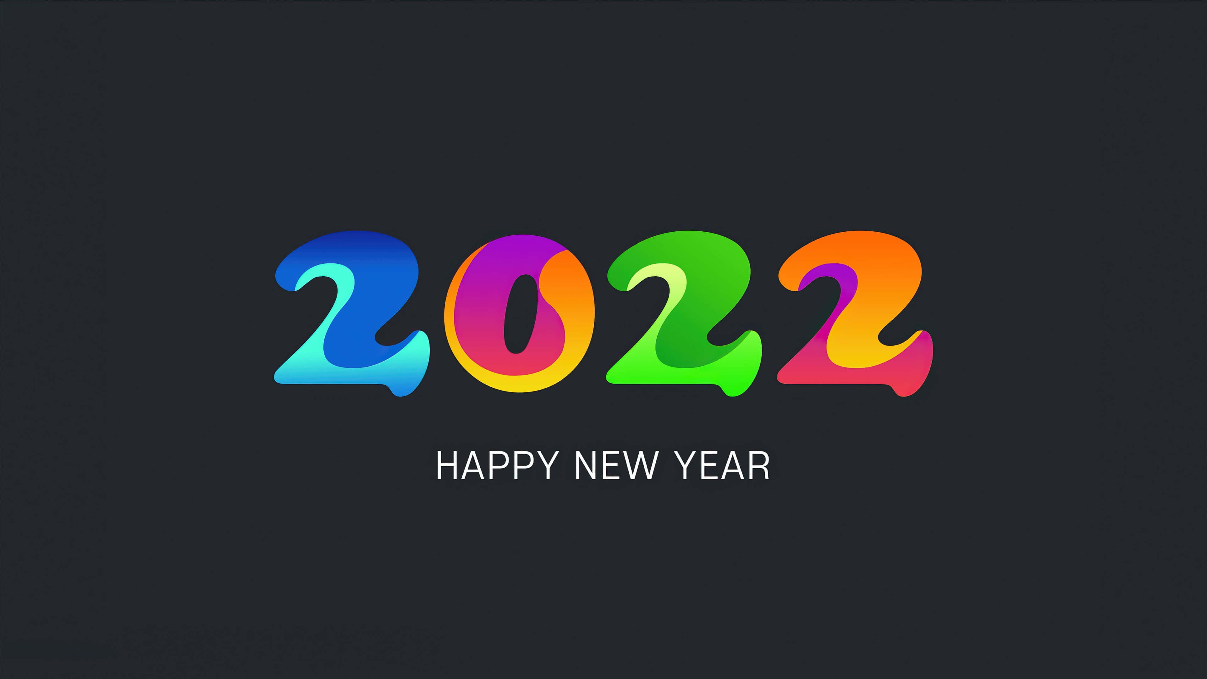 新年 桌布 壁紙 — 在深色背景上，鮮豔的彩虹色 2022 文字，下方有「HAPPY NEW YEAR」。