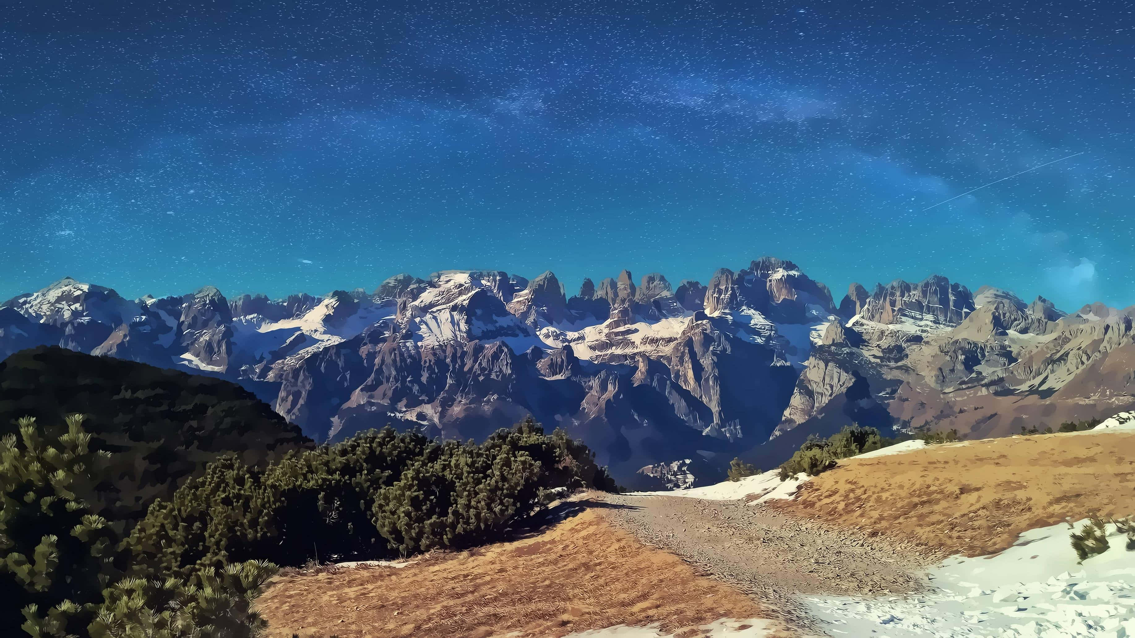 Beautiful View 桌布 壁紙 — 在深藍色的蒼穹下，銀河拱跨雪覆山脈的星空夜晚。