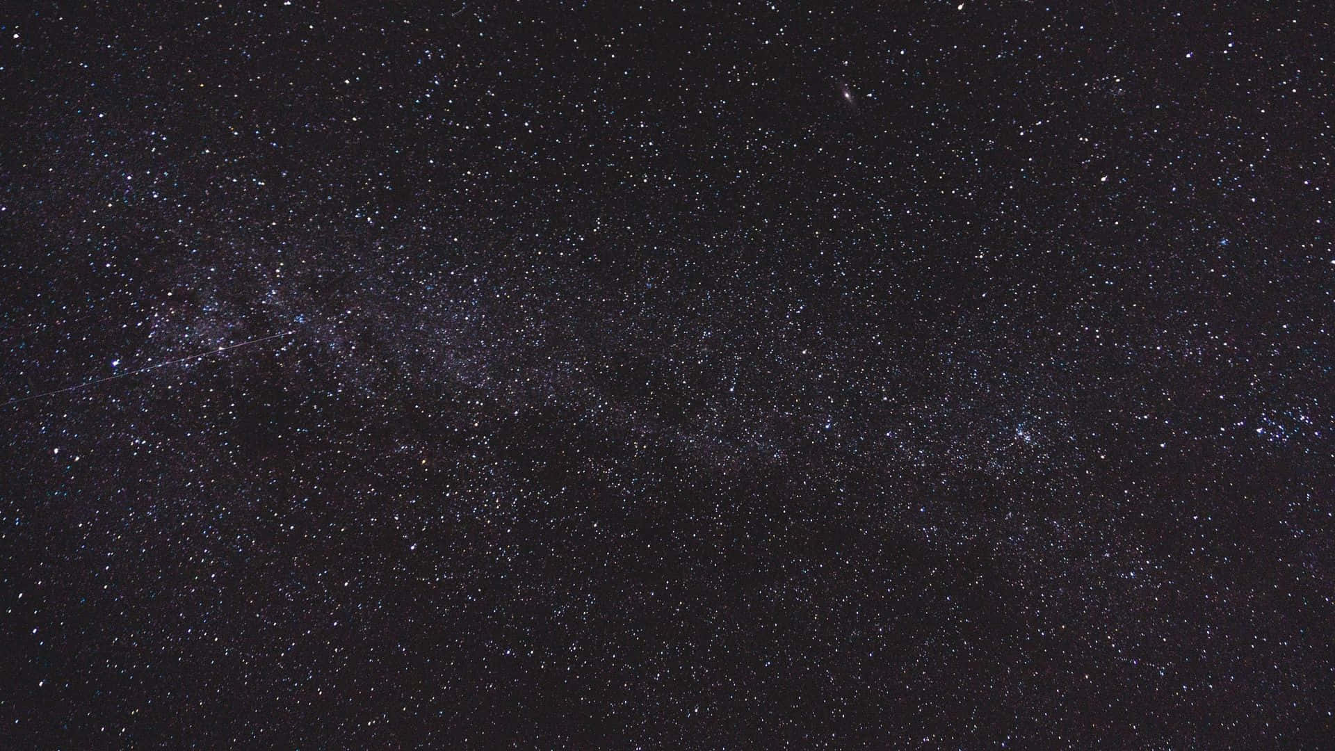 Dark Sky 桌布 壁紙 — 在深邃的黑色夜空中，銀河系閃爍著無數星辰的壯麗景象。