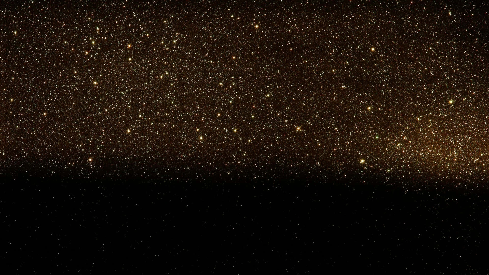 閃爍 桌布 壁紙 — 在深邃黑色地平線上方閃耀的金色星空的壯麗景色。