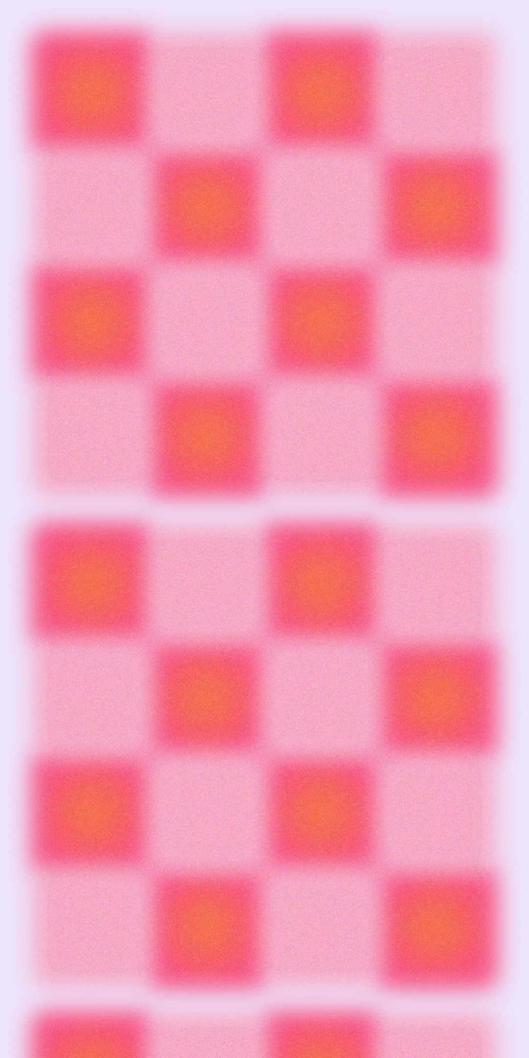 Checkered 桌布 壁紙 — 在淺色背景上，粉紅色和橙色方塊的柔和模糊棋盤格圖案。