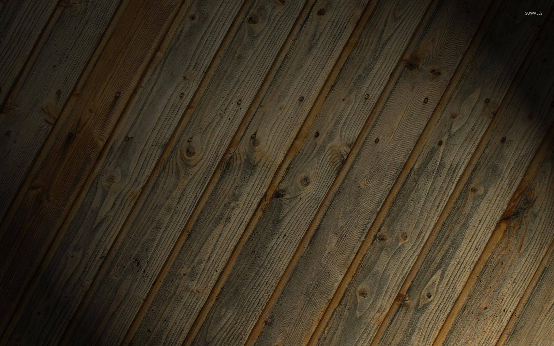 Wood Texture 桌布 壁紙 — 在溫暖定向光線下的對角木質板，帶有天然紋理和節疤。