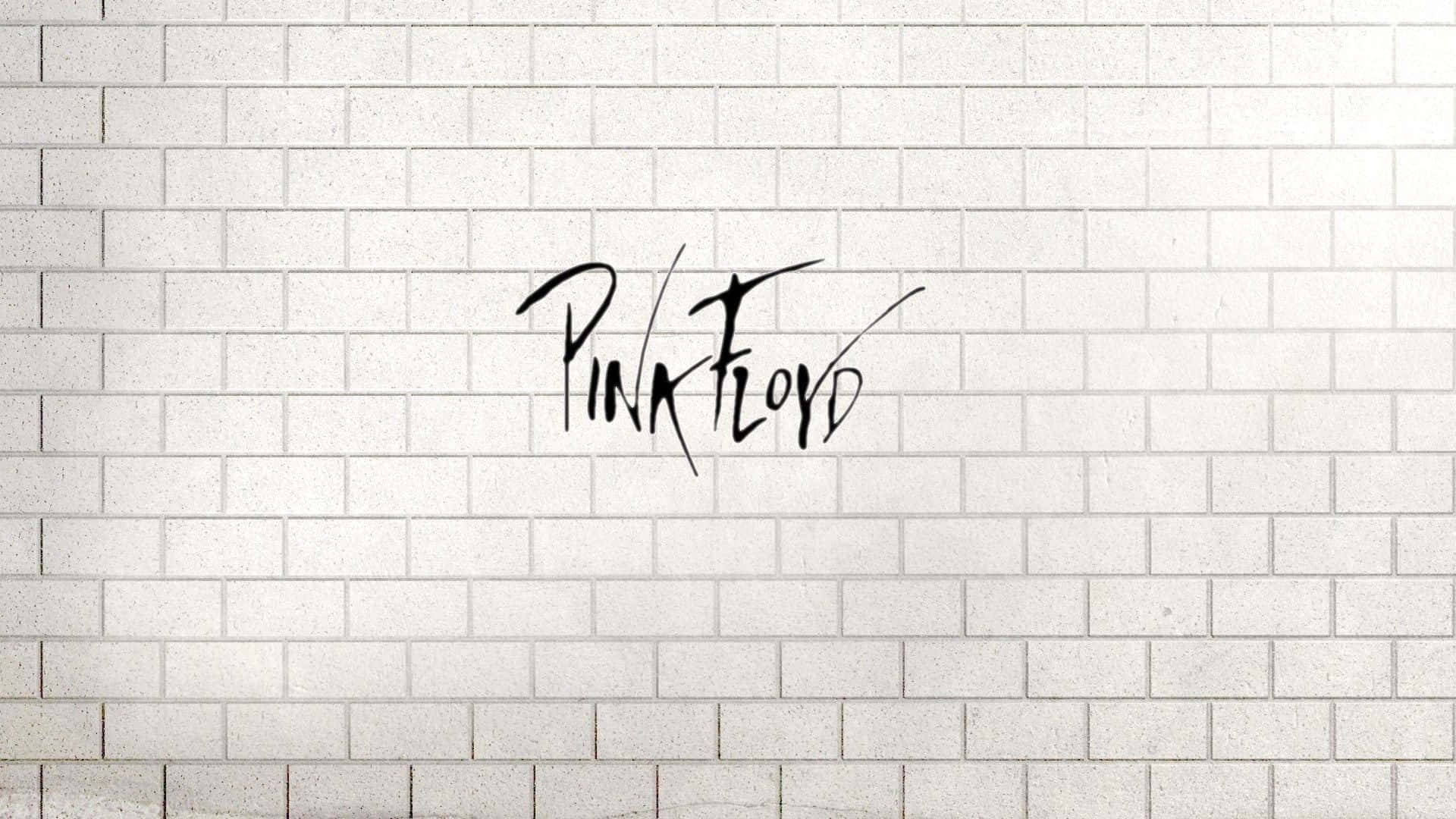 桌布 壁紙 — 在潔白磚牆上以粗黑草書繪製的Pink Floyd標誌塗鴉。