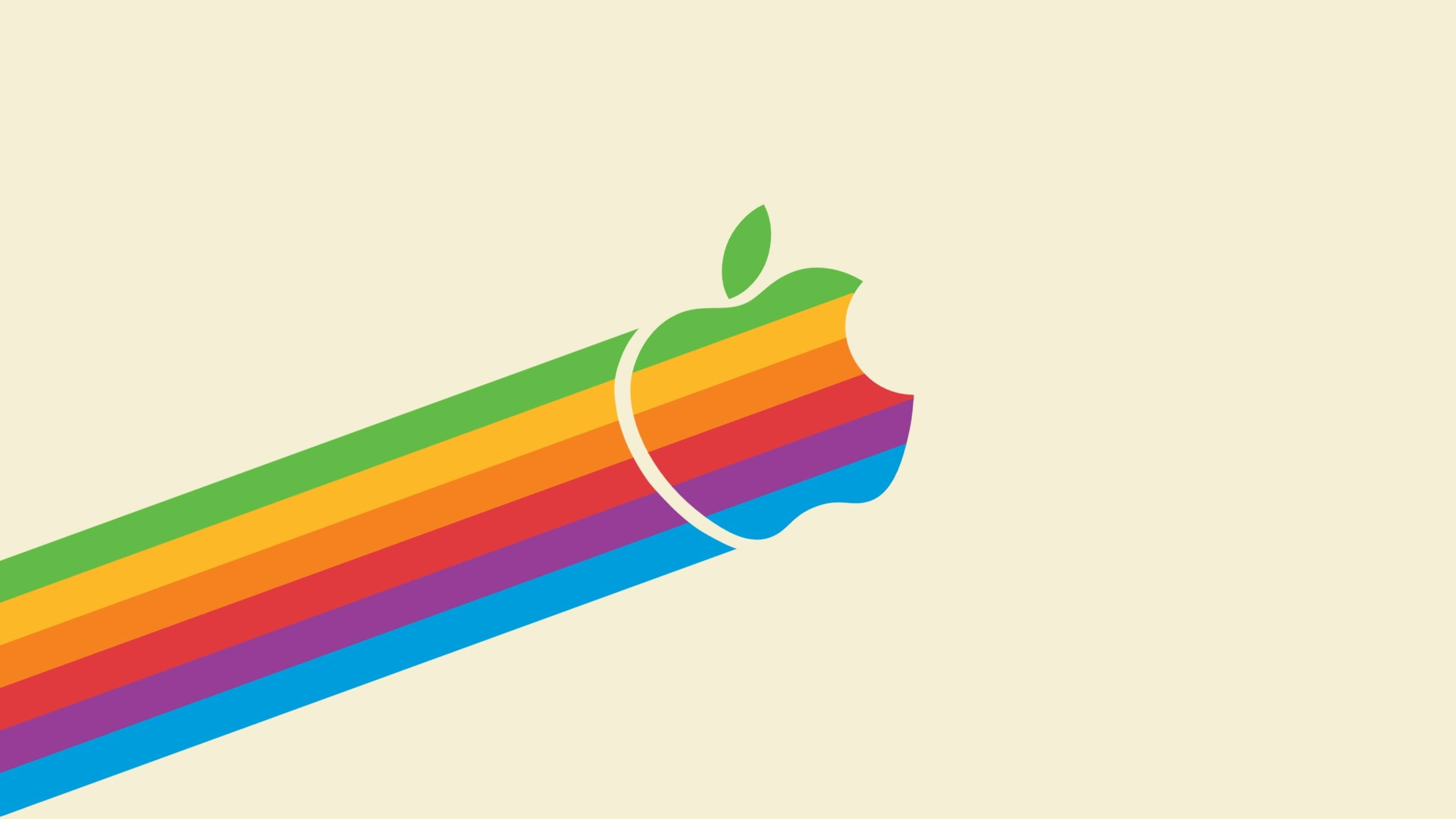 Apple 4K Ultra HD 桌布 壁紙 — 在米色背景上，帶有咬痕和綠色葉子的彩虹條紋 Apple 標誌。
