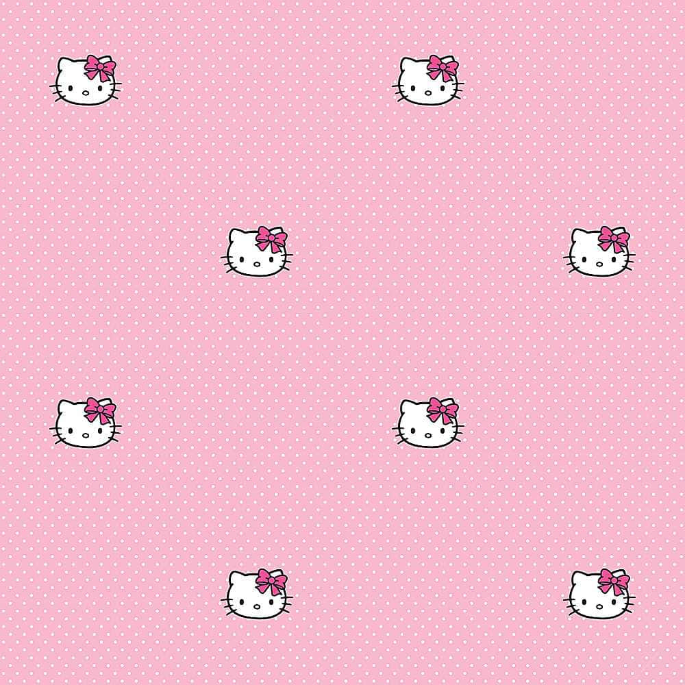 Hello Kitty 桌布 壁紙 — 在粉紅色圓點背景上重複出現的Hello Kitty臉孔，配有粉紅色蝴蝶結。
