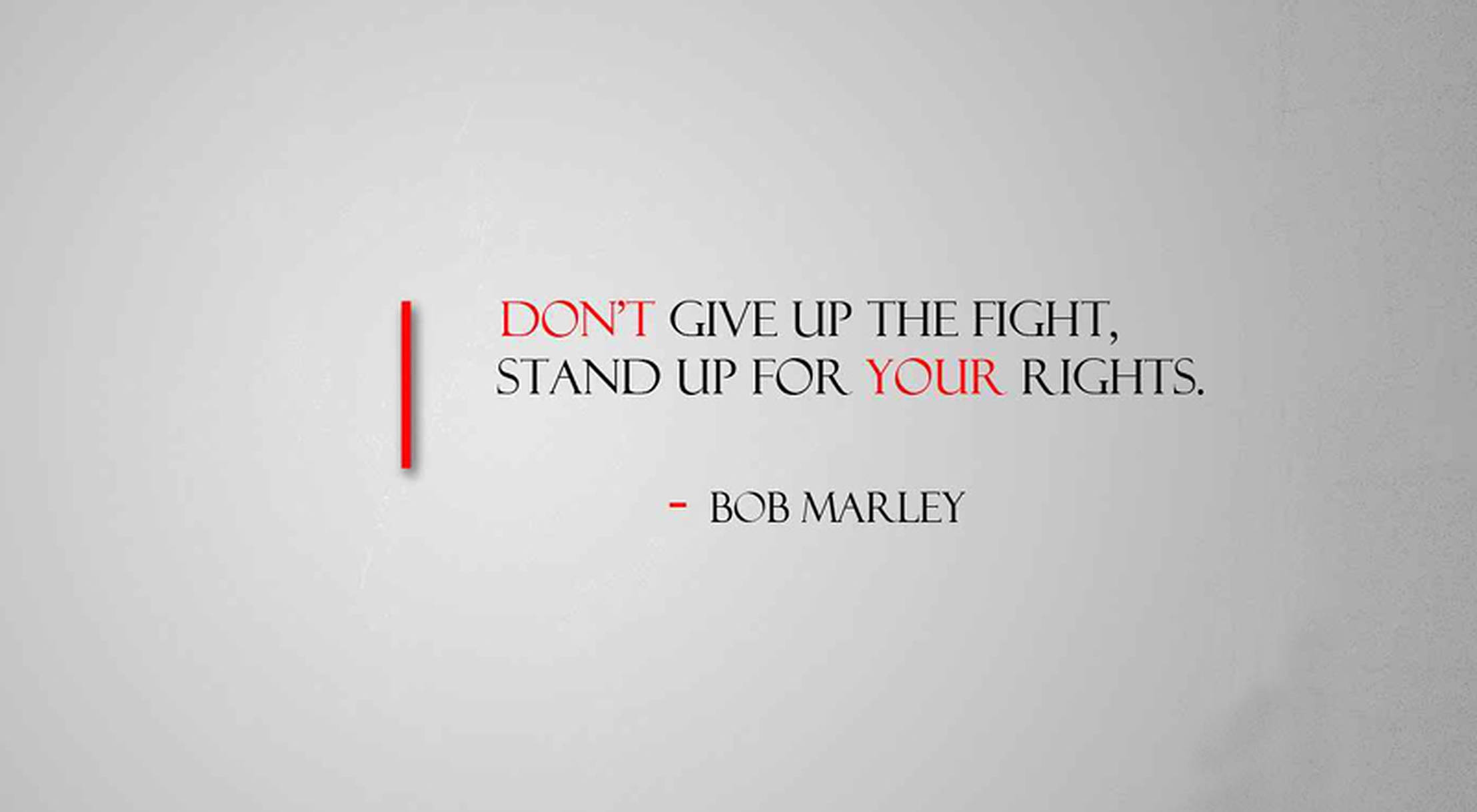 bob 桌布 壁紙 — 在紋理灰色背景上，以粗體紅色和黑色文字呈現的 Bob Marley 極簡勵志名言。