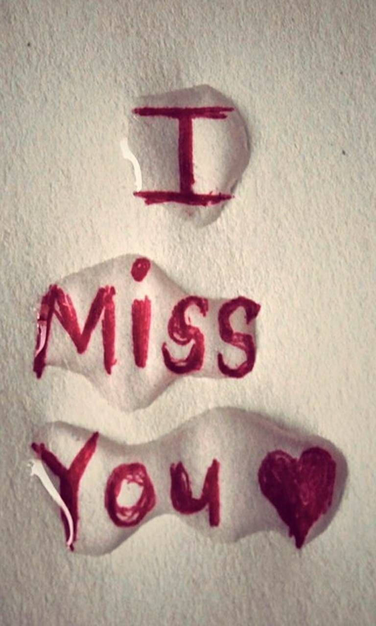 我想你 桌布 壁紙 — 在紋理白紙上手寫的紅色「I Miss You」訊息，附有一顆心，看起來稍微模糊且充滿情感。