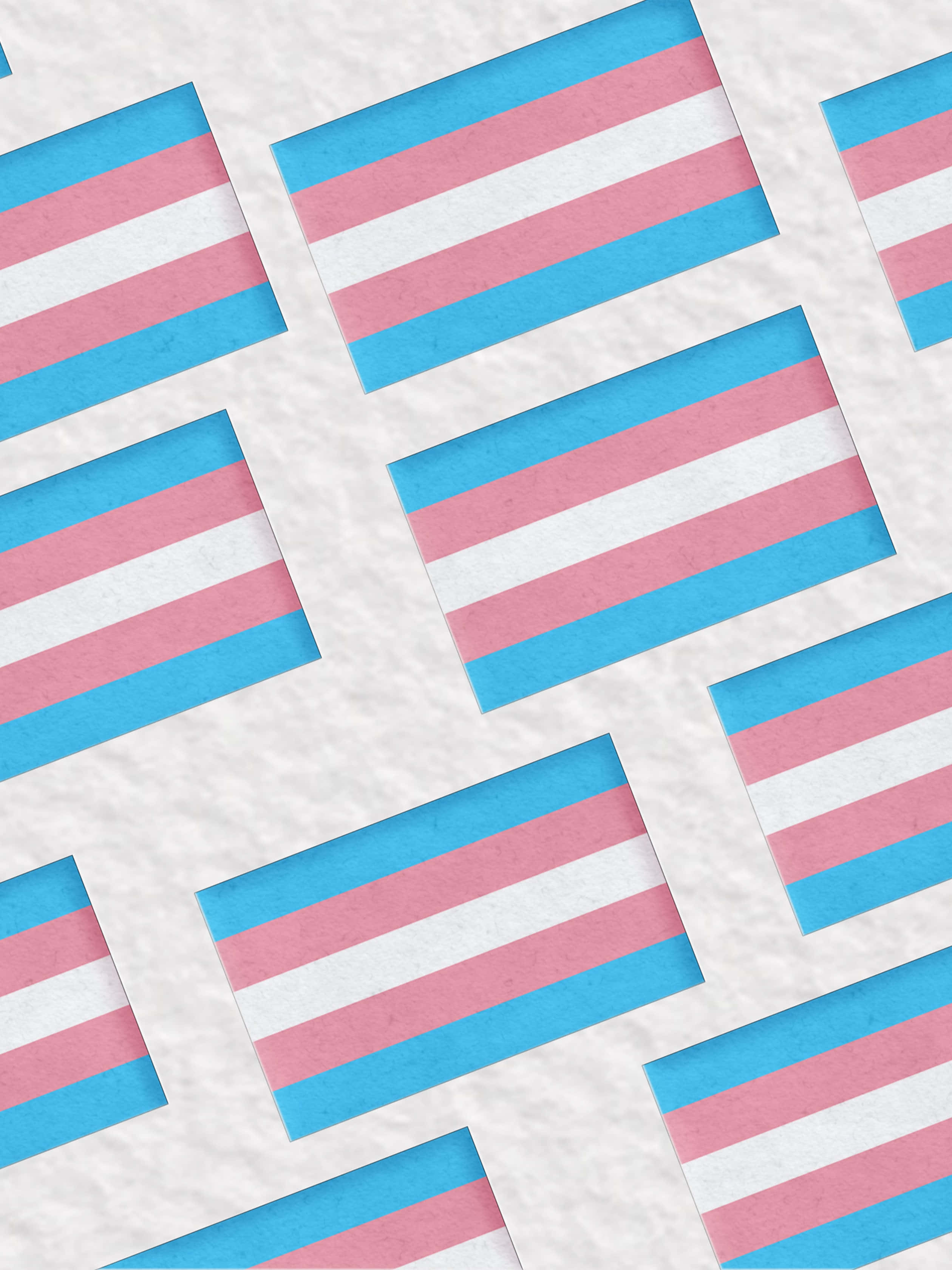 Trans Flag 桌布 壁紙 — 在紋理紙上重複的跨性別驕傲旗幟，創造出由藍色、粉紅色和白色條紋組成的醒目圖案。