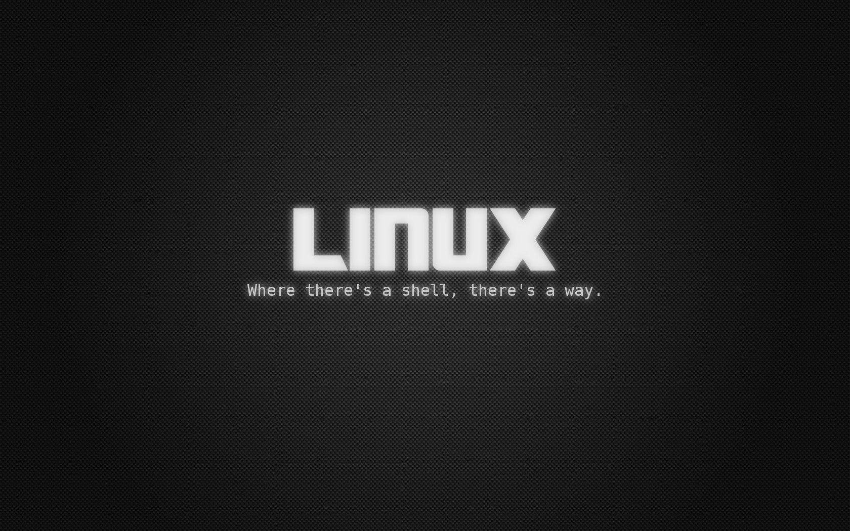 桌面 桌布 壁紙 — 在紋理黑色背景上的粗體白色「LINUX」文字及標語。
