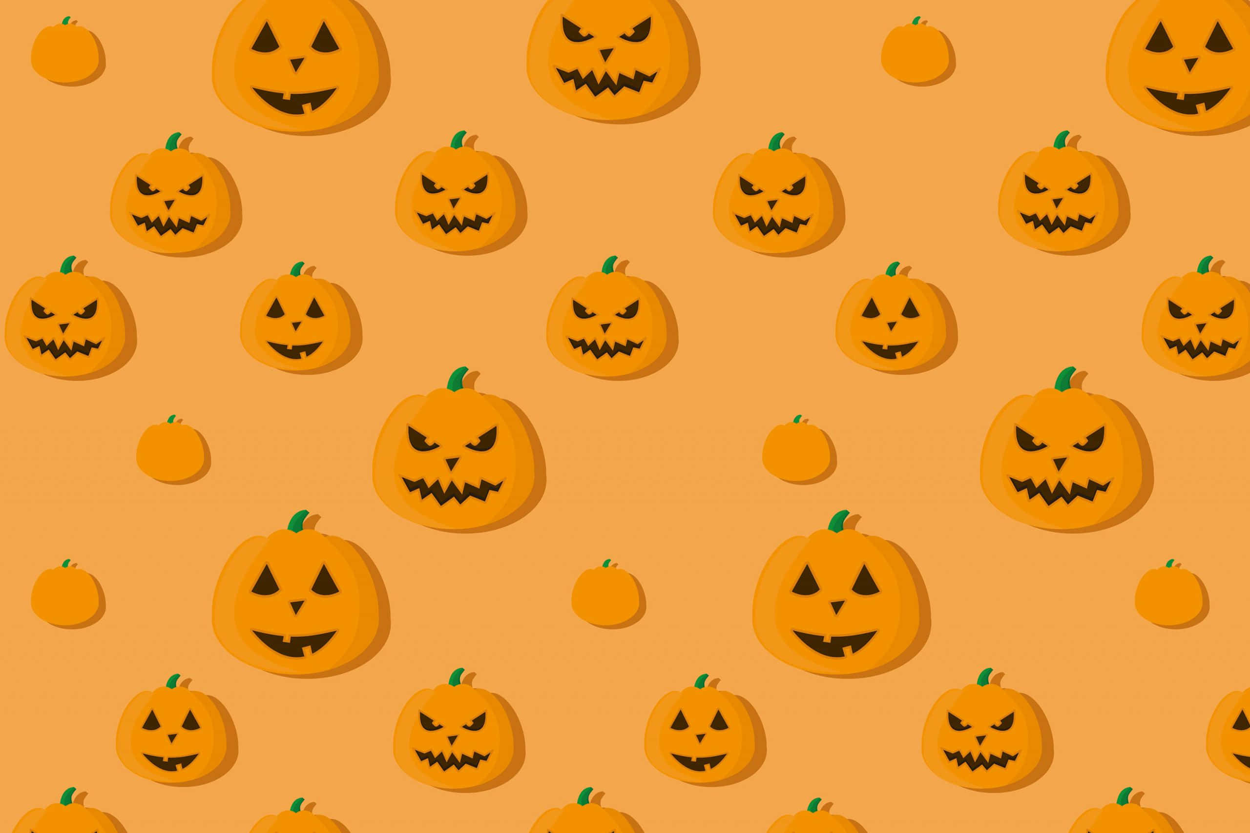 pumpkins 桌布 壁紙 — 在純橙色背景上，重複出現帶有各種恐怖笑容的卡通橙色南瓜圖案。