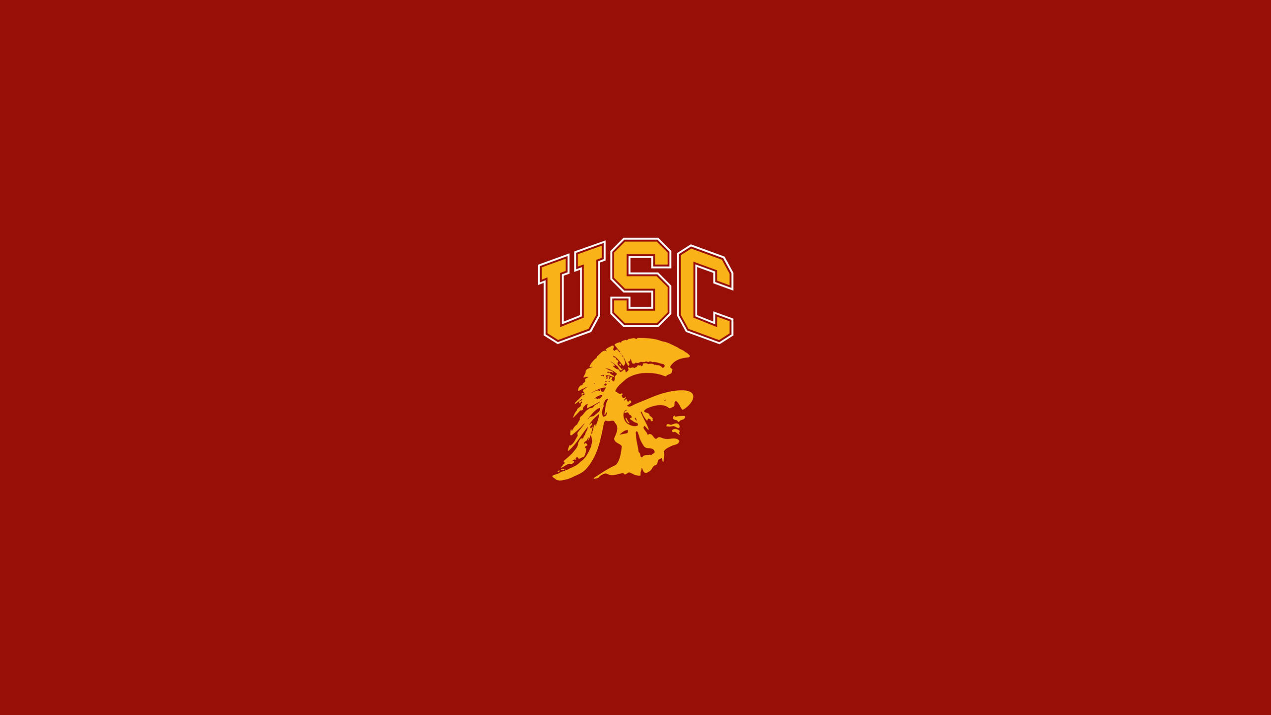 Usc 桌布 壁紙 — 在純深紅色背景上的金色大膽USC Trojan標誌。