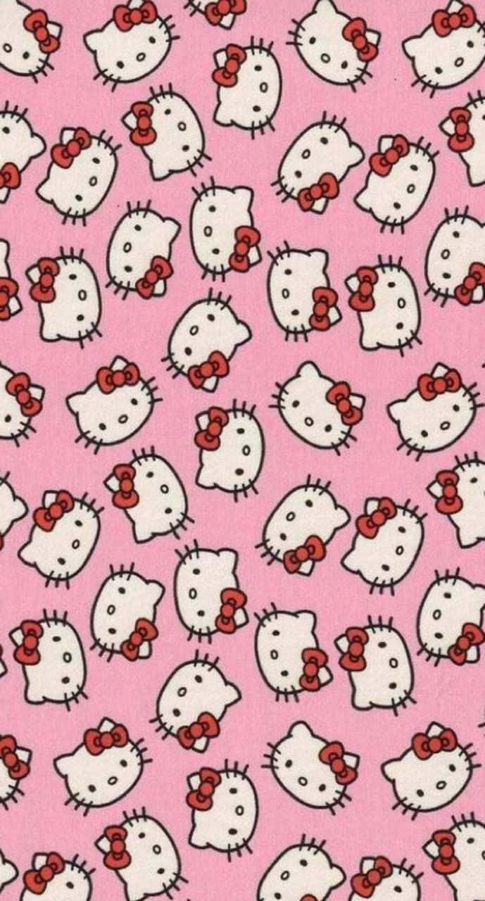 Hello Kitty 桌布 壁紙 — 在純粉紅色背景上重複出現帶有紅色蝴蝶結的白色Hello Kitty面孔。