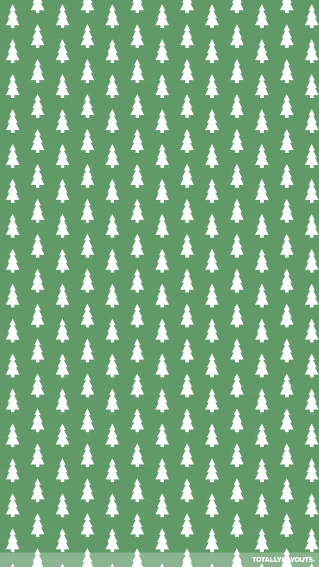 Cute Christmas Tree 桌布 壁紙 — 在純綠色背景上重複出現的白色松樹圖案，營造出極簡風格的節日桌布。