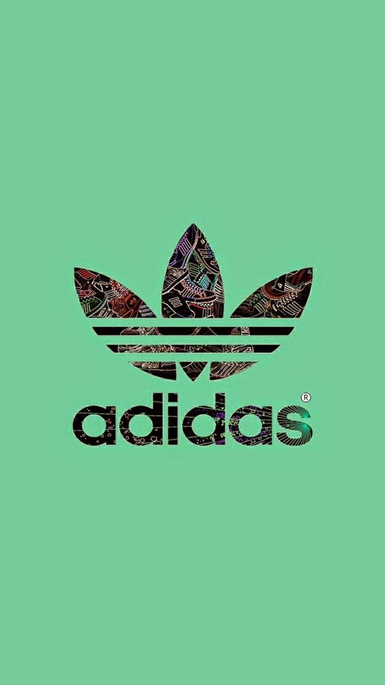 品牌 桌布 壁紙 — 在純薄荷綠色背景上，三葉草內帶有複雜部落圖案的Adidas標誌。