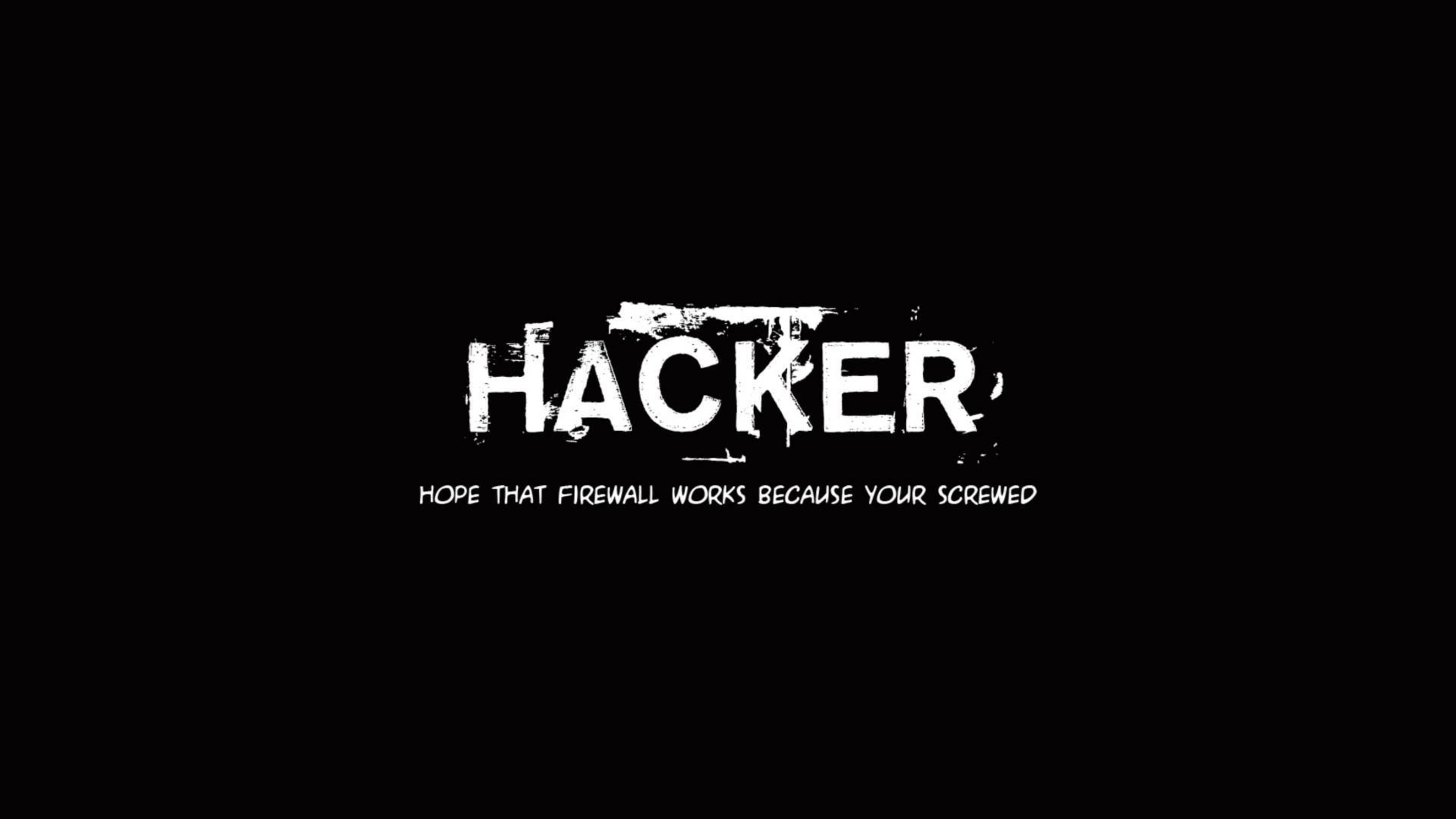 駭客 桌布 壁紙 — 在純黑色背景上，以粗體白色塗鴉風格文字拼寫 HACKER，下方附有幽默標語。