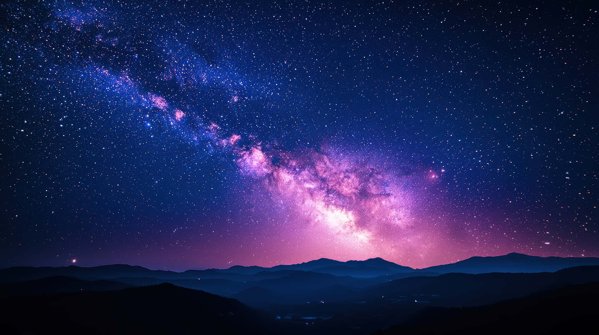 Breathtaking Milky Way Galaxy Over a Serene Mountain Landscape at Night 壁紙 — 在繁星點點的夜空下，黑暗山脈上方閃耀著充滿活力的紫色和藍色色調的銀河系的壯麗景色。