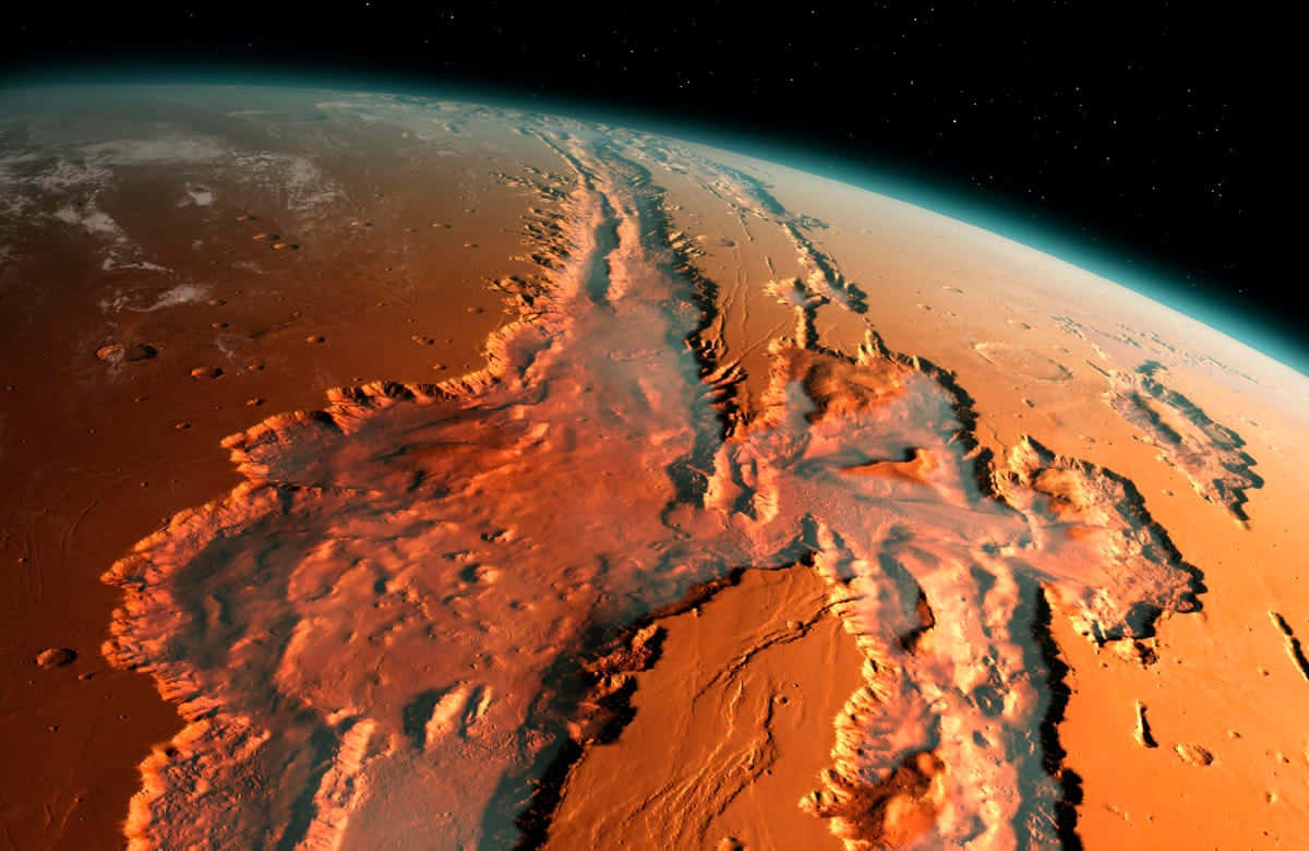 Mars Planet 桌布 壁紙 — 在繁星點點的黑色天空下，火星的鏽色表面和廣闊峽谷系統的壯麗景色。