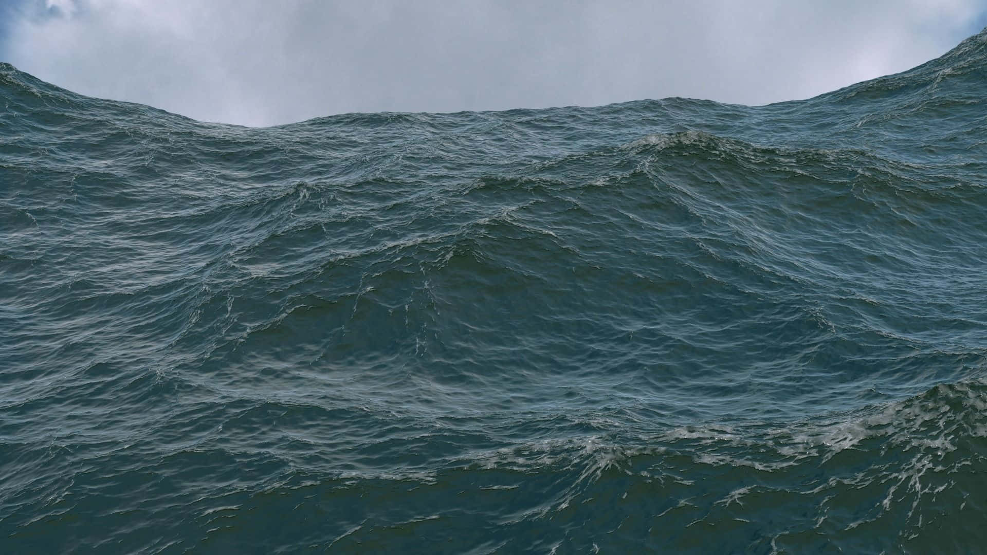 3d Ocean 桌布 壁紙 — 在陰天之下，深藍綠色波濤洶湧的大海。