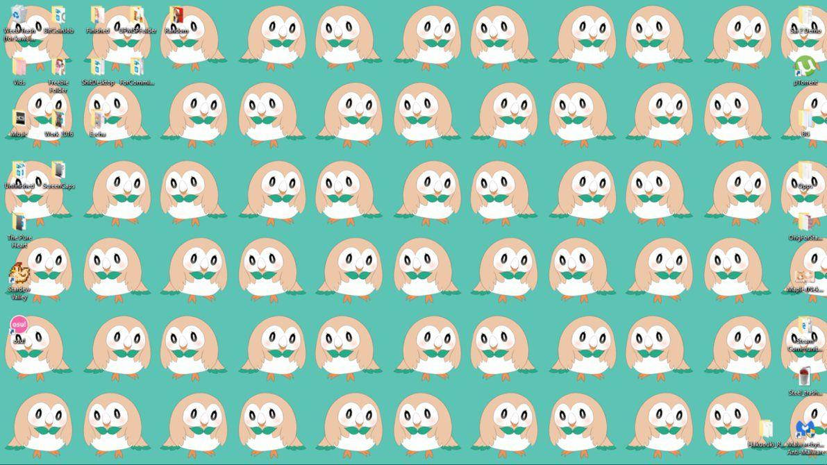 Rowlet 桌布 壁紙 — 在青綠色背景上重複的可愛卡通貓頭鷹角色圖案，桌面圖示可見。
