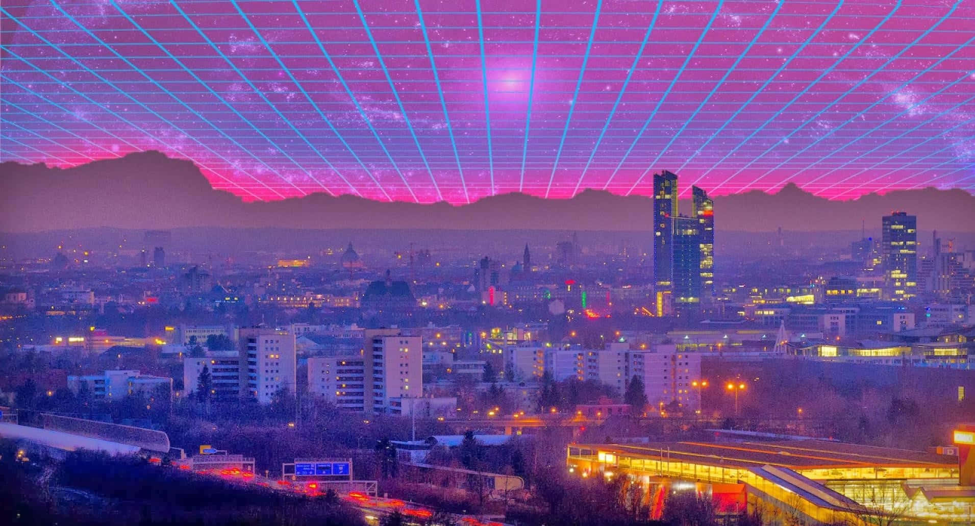 Retro Futurism 桌布 壁紙 — 在黃昏時分，未來主義的城市景觀，上方是發光的粉紅和藍色網格天空，遠處有山巒。