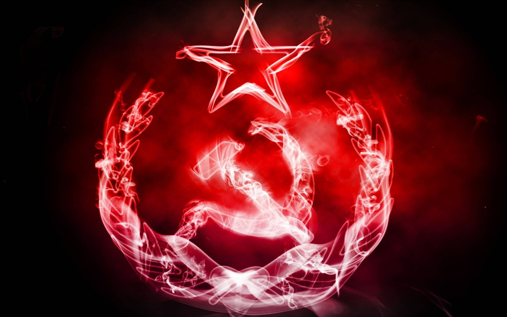 Union 桌布 壁紙 — 在黑暗背景上由旋轉煙霧形成的發光紅色錘子鐮刀星徽章。