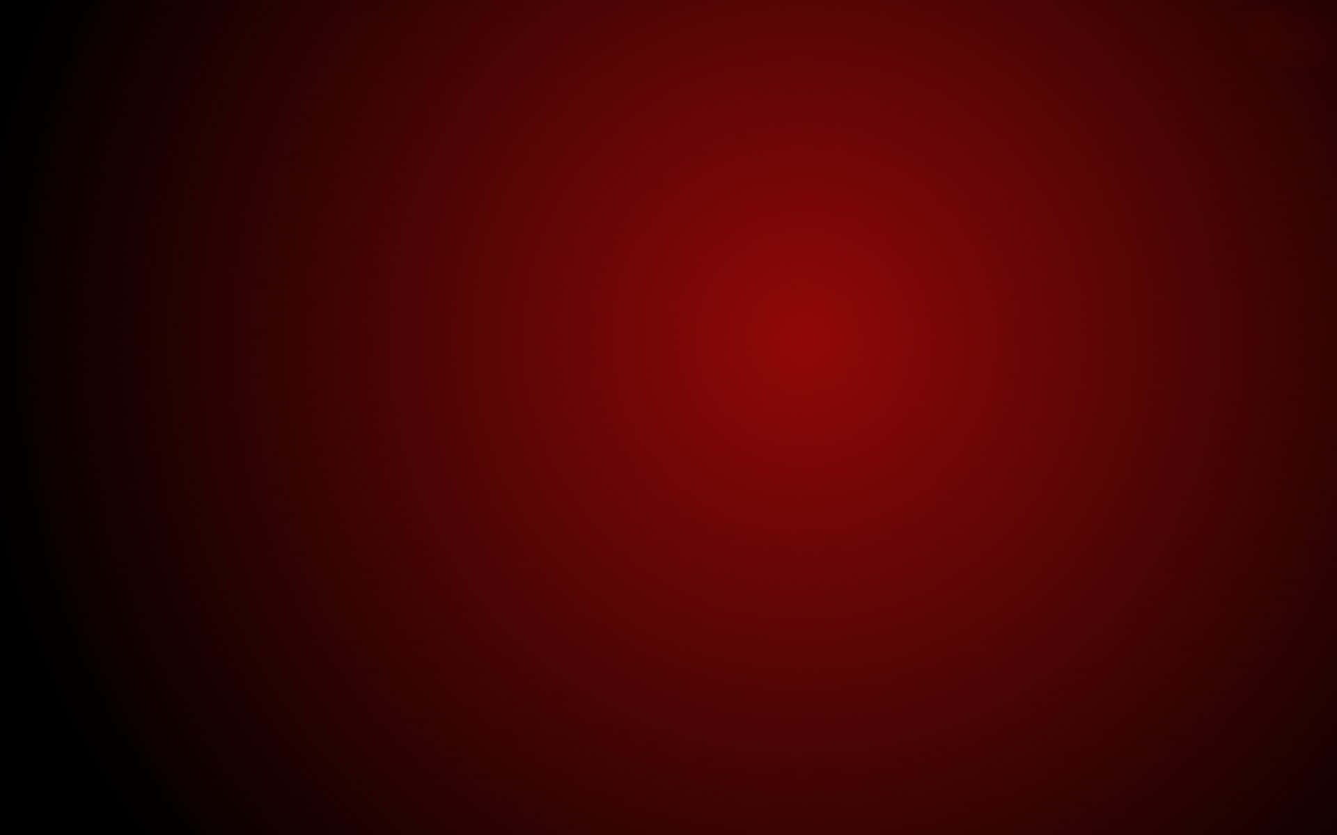 colors 桌布 壁紙 — 在黑色背景上，從明亮中心向外輻射的深紅色催眠漸變。