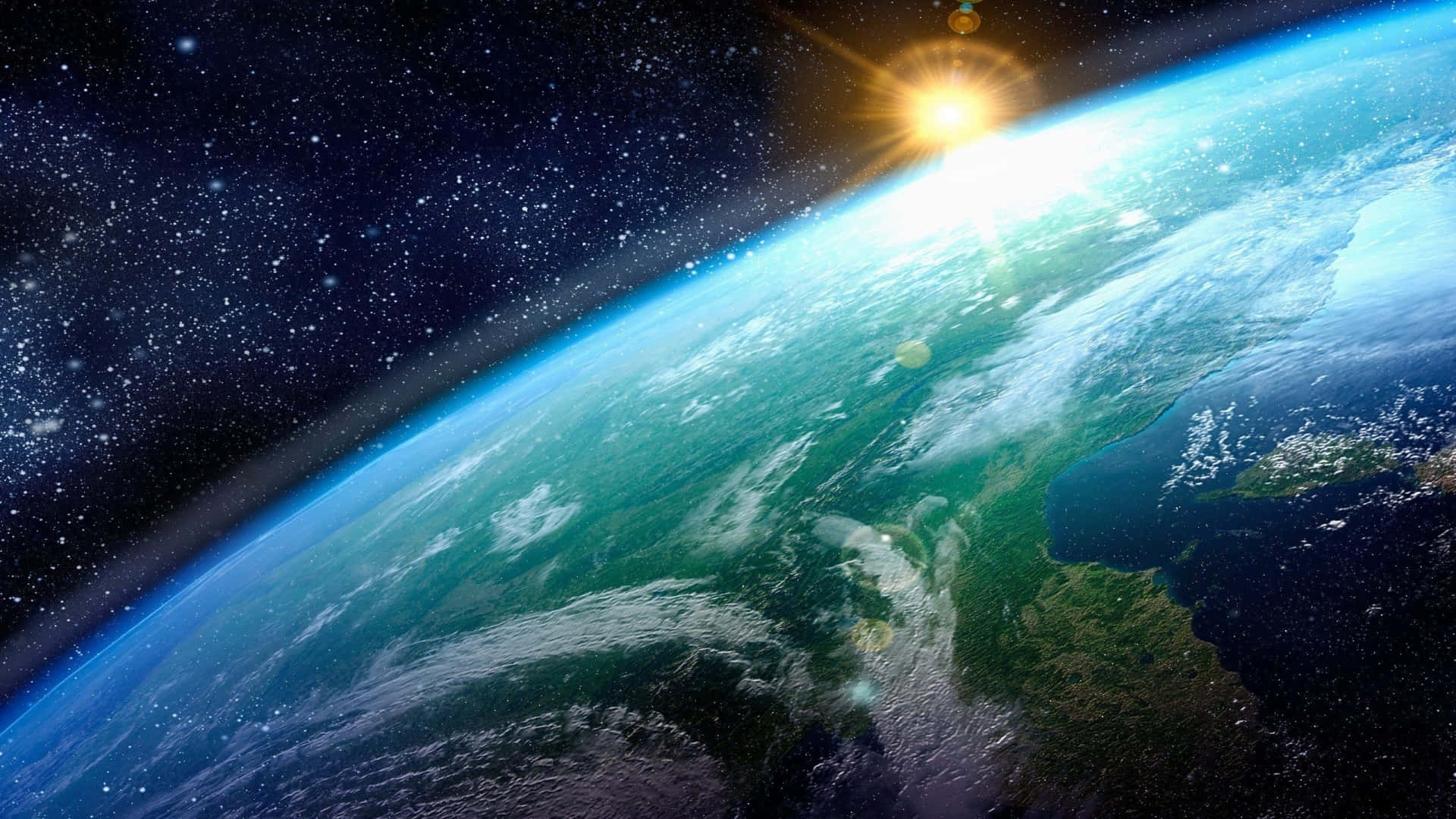 地球 桌布 壁紙 — 地球在太空中雄偉地彎曲，太陽在其點綴著雲層和陸地的藍綠色表面上燃燒。