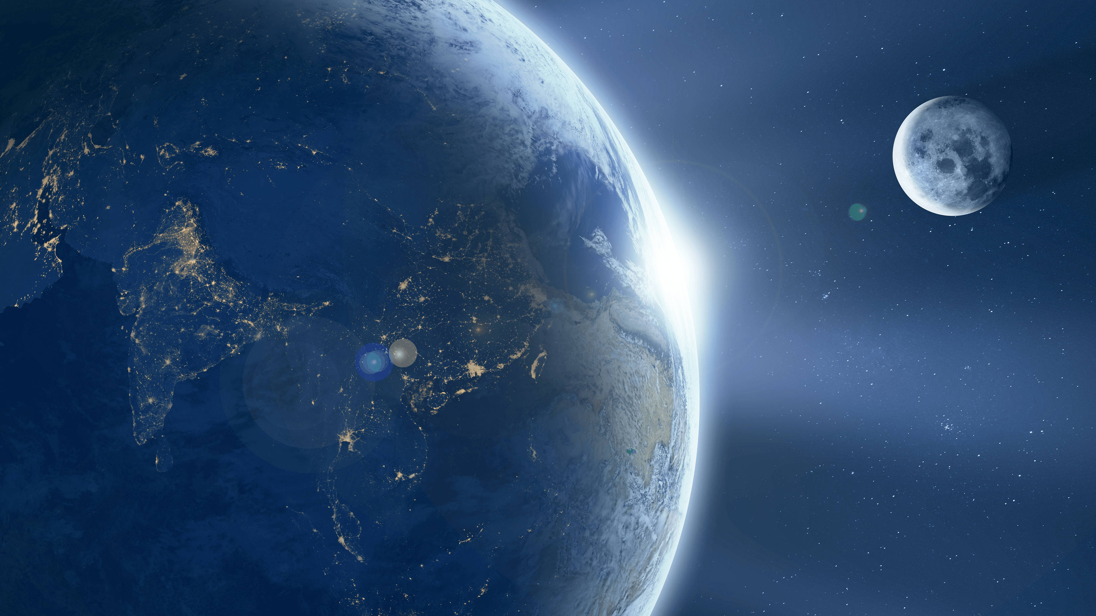 4K Computer 桌布 壁紙 — 地球在黑暗的宇宙中閃耀著城市燈光，而月球在星空附近運行。