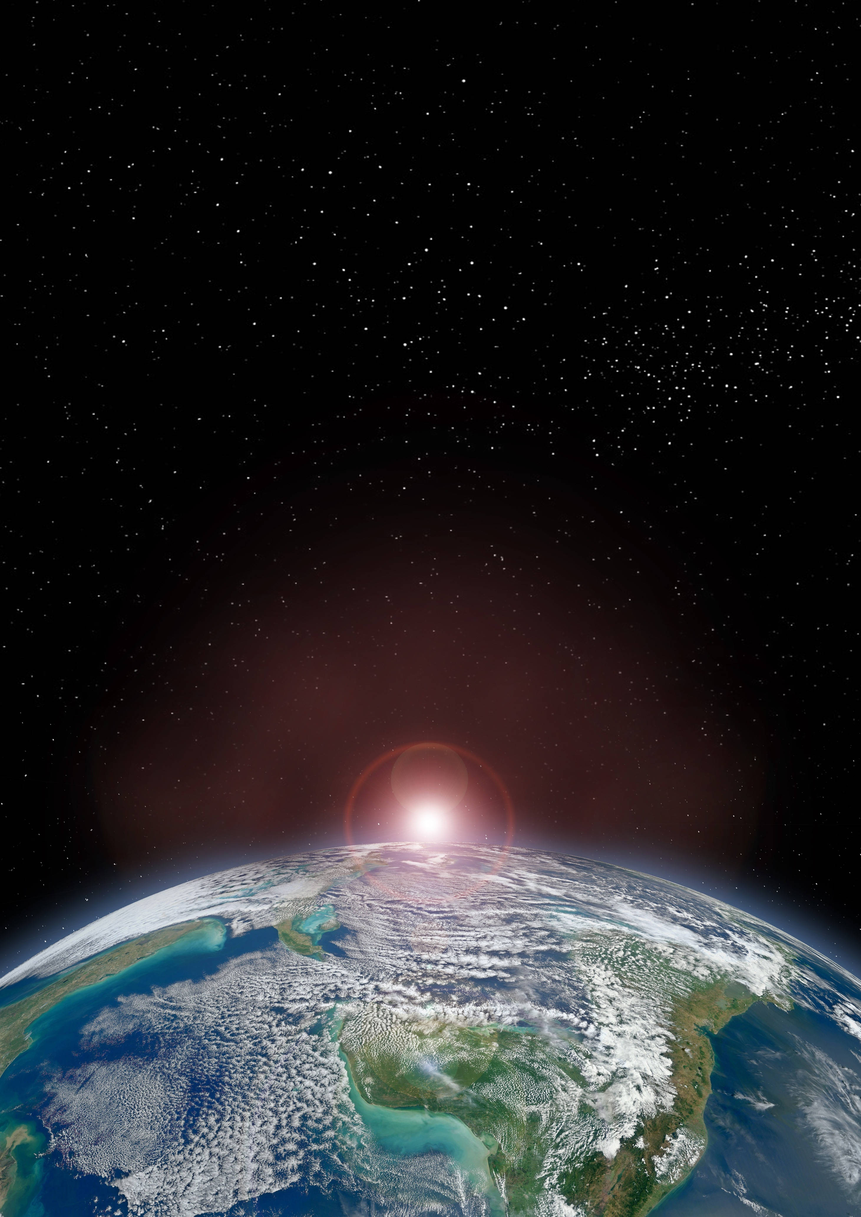 地球 桌布 壁紙 — 地球從太空升起，一顆發光的太陽在星空下為大陸和海洋投射出溫暖的光暈。