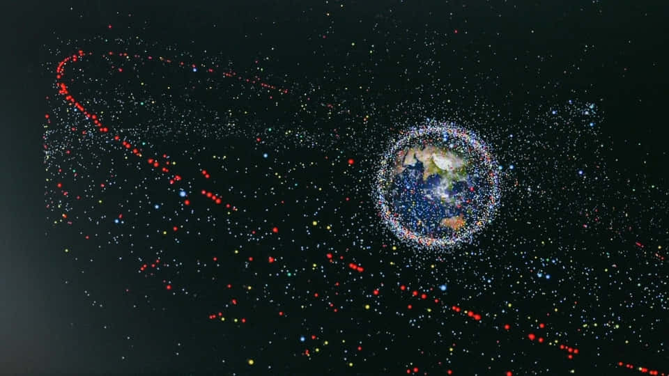 Space Debris 桌布 壁紙 — 地球被密集的彩色衛星軌跡雲層包圍，背景是繁星點點的黑色天空。