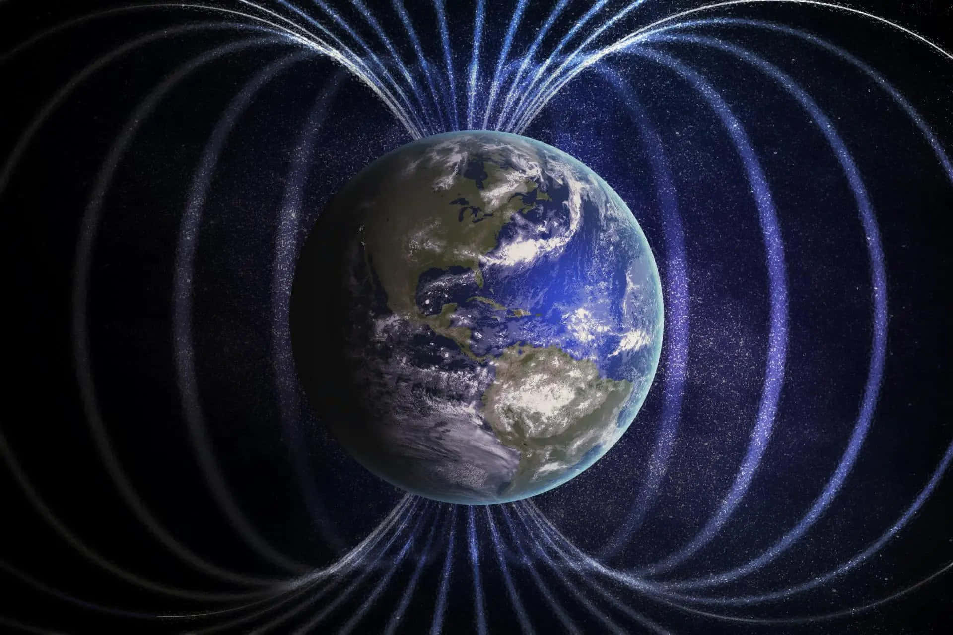 Magnetic Field 桌布 壁紙 — 地球被發光藍色磁場線包圍，背景是繁星點點的宇宙。