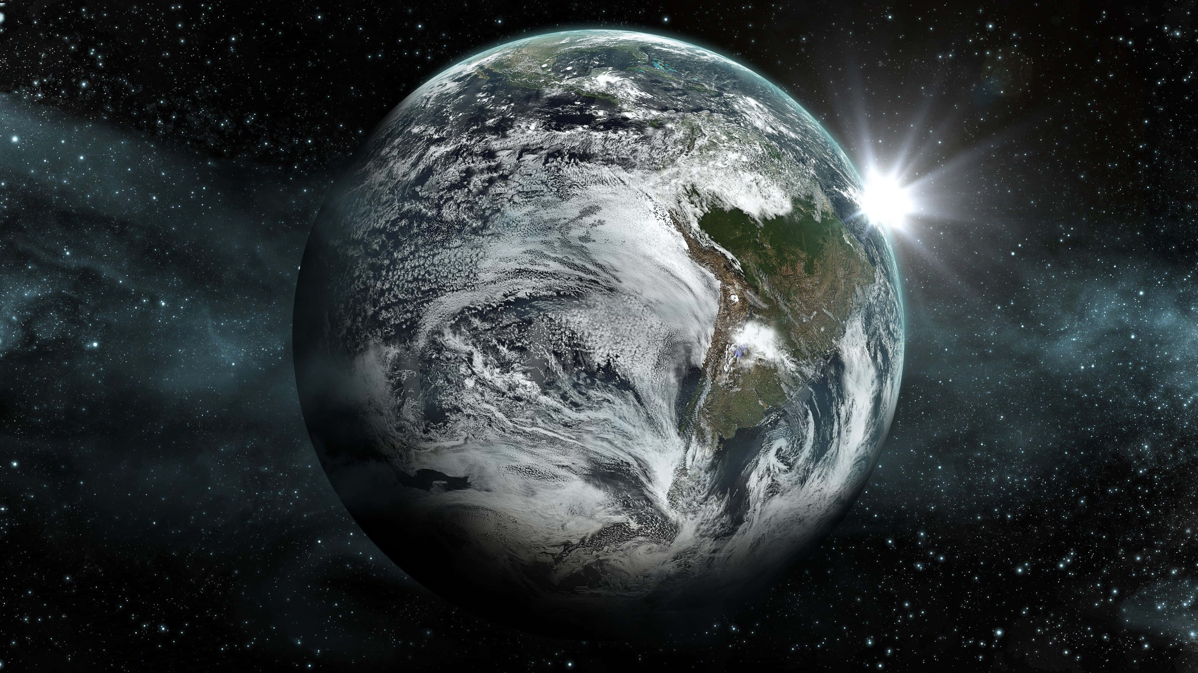 Exoplanet 桌布 壁紙 — 地球閃耀著旋轉的雲層和陸地，陽光從後方迸發，映襯著繁星點點的宇宙背景。