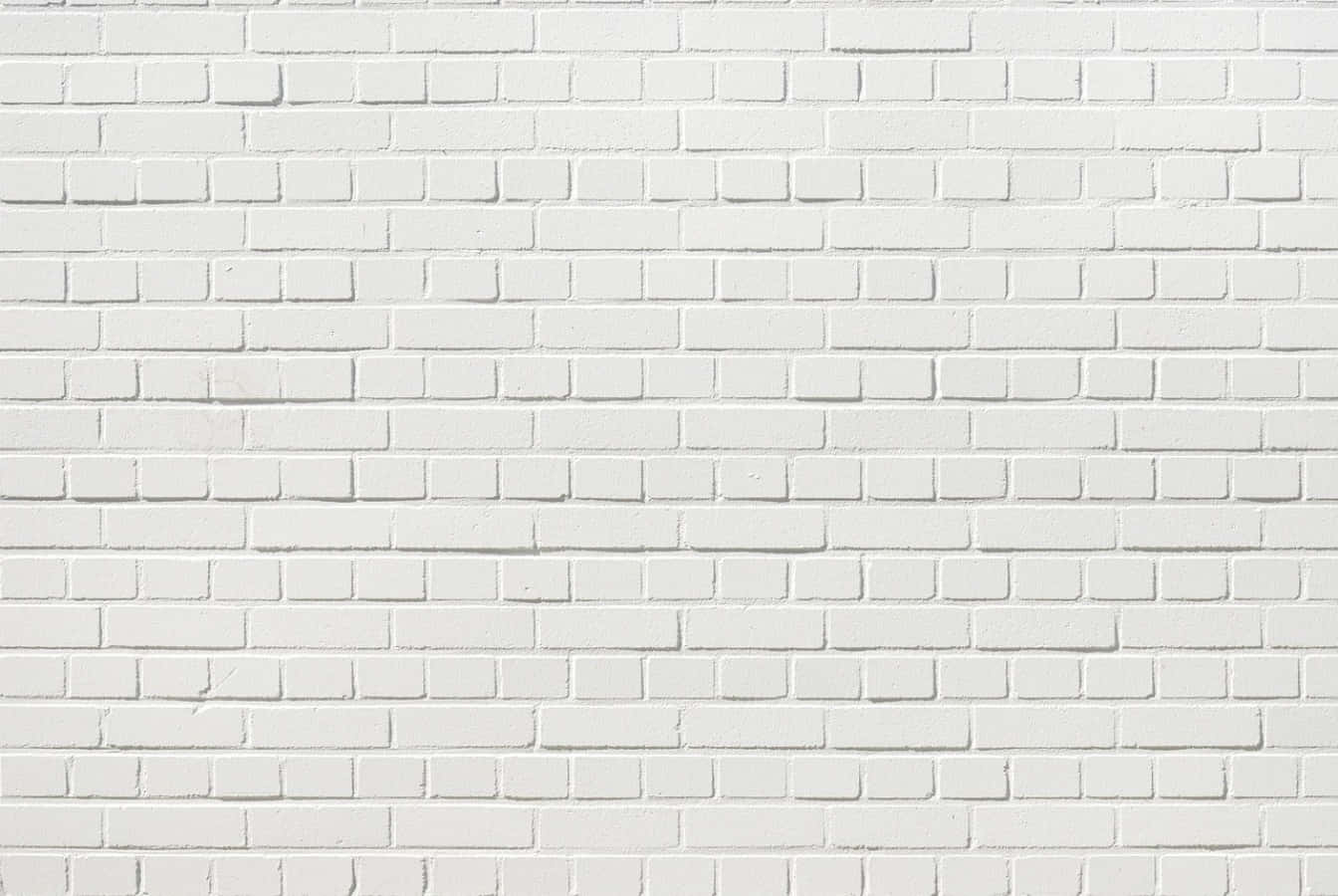 White Brick Wall 桌布 壁紙 — 均勻照明下，帶有細微紋理和砂漿線的清潔白色磚牆。
