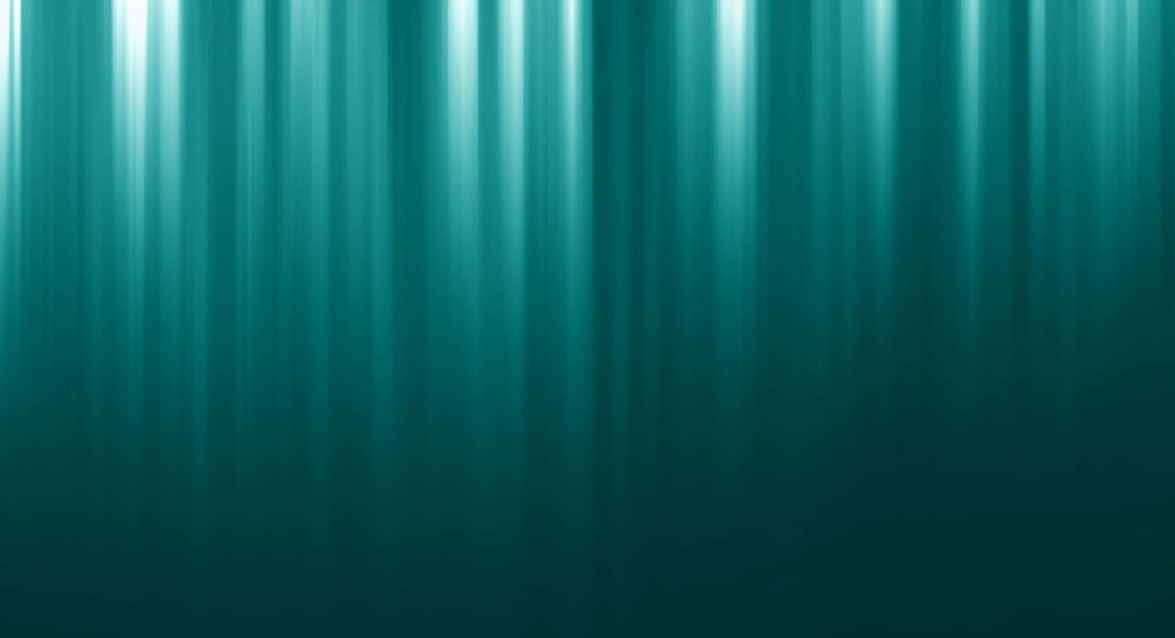 Dark Teal 桌布 壁紙 — 垂直光線穿透深藍綠色海水，營造出寧靜的水下光芒。