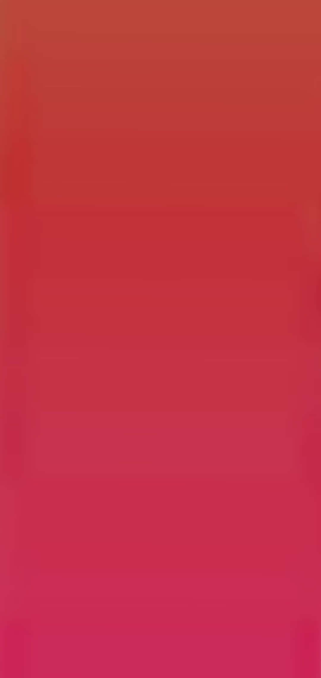 Solid iPhone 桌布 壁紙 — 垂直漸變壁紙，從頂部的深紅色過渡到底部的鮮豔洋紅色。