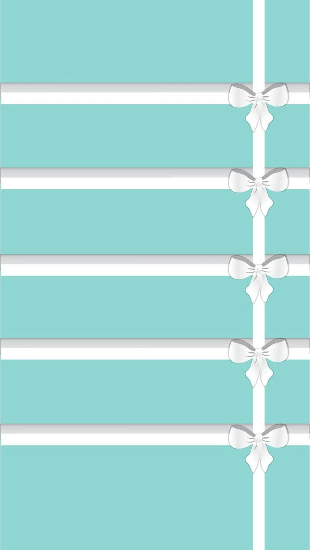 tiffany 桌布 壁紙 — 垂直青綠色和白色條紋壁紙，中央條紋上間隔有銀色蝴蝶結。