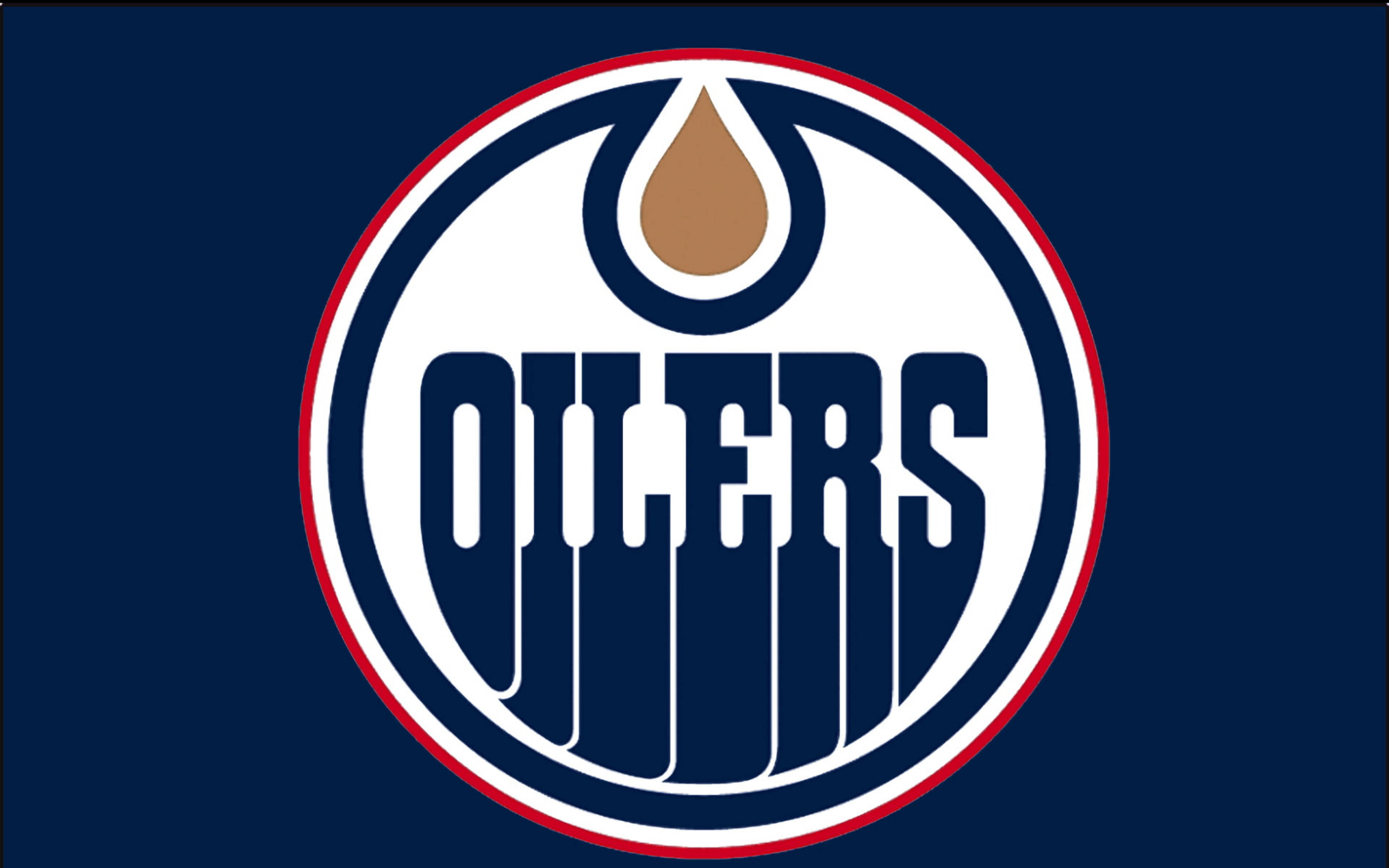 Oilers 桌布 壁紙 — 埃德蒙頓油人隊標誌以海軍藍背景上的圓形徽章內，在粗體字上方有一個風格化的油滴。