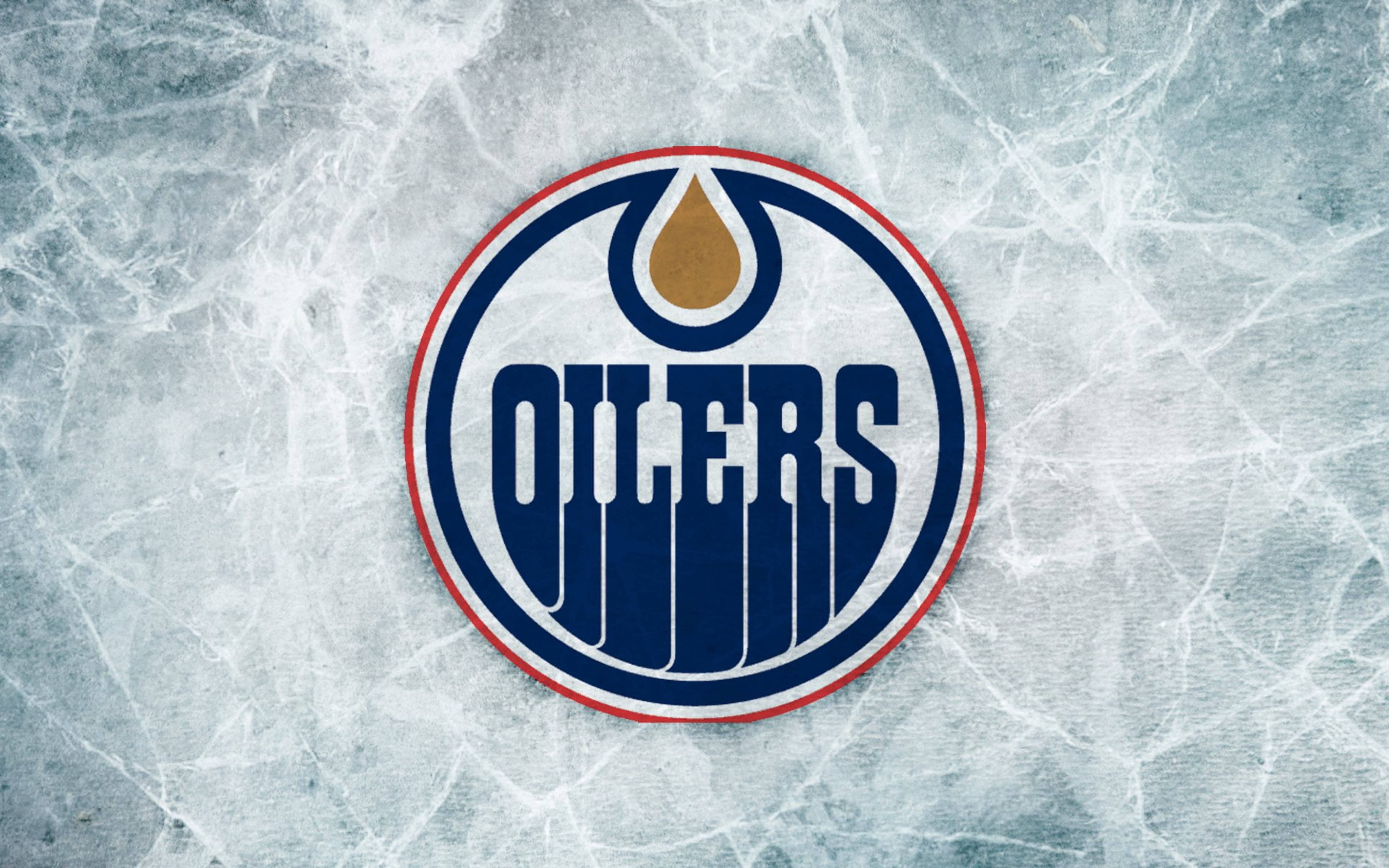 Oilers 桌布 壁紙 — 埃德蒙頓油人隊標誌居中於裂冰紋理上，帶有藍色、金色和紅色點綴。