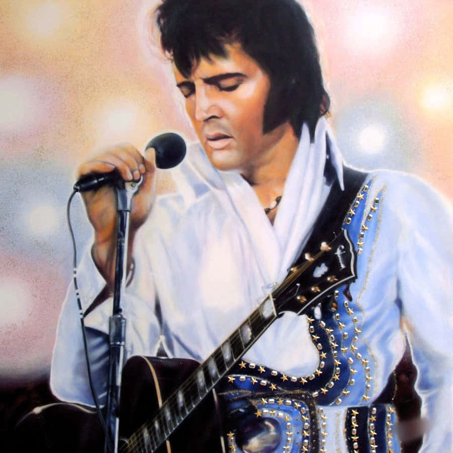 Elvis 桌布 壁紙 — 埃爾維斯·普雷斯利在舞台燈光下，手持星形裝飾吉他，熱情地對著麥克風唱歌。