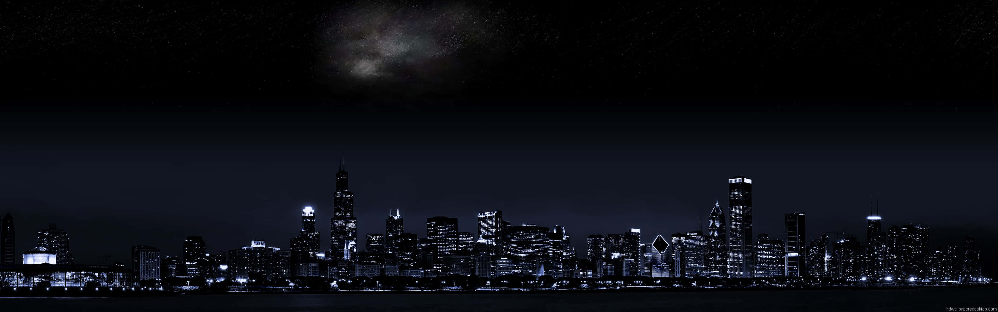 桌布 壁紙 — 城市天際線的夜景全景，星空下銀河拱橋橫跨天際。