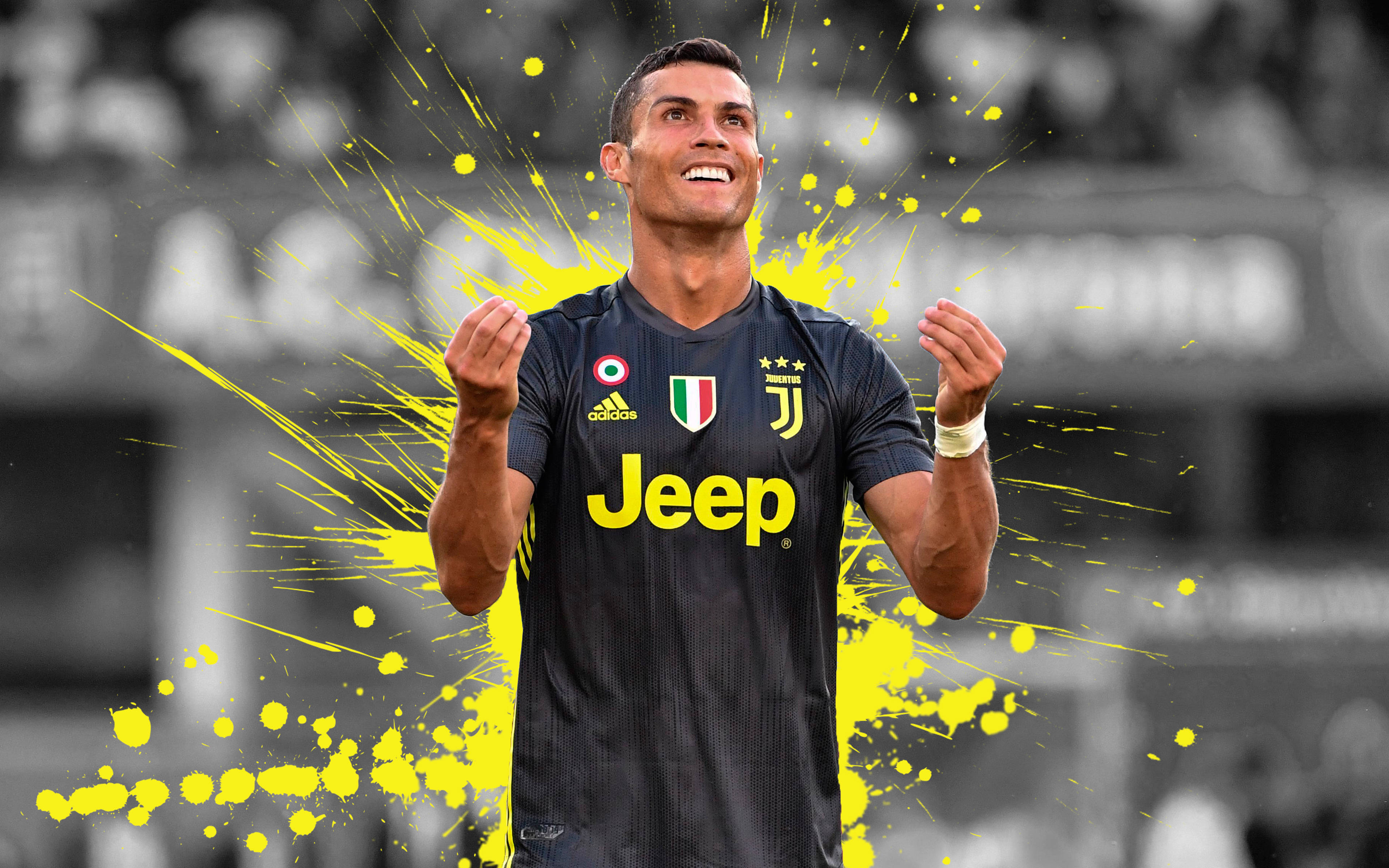 Ronaldo 桌布 壁紙 — 基斯坦奴·朗拿度身穿祖雲達斯球衣慶祝，周圍散發著充滿活力的黃色油漆飛濺。