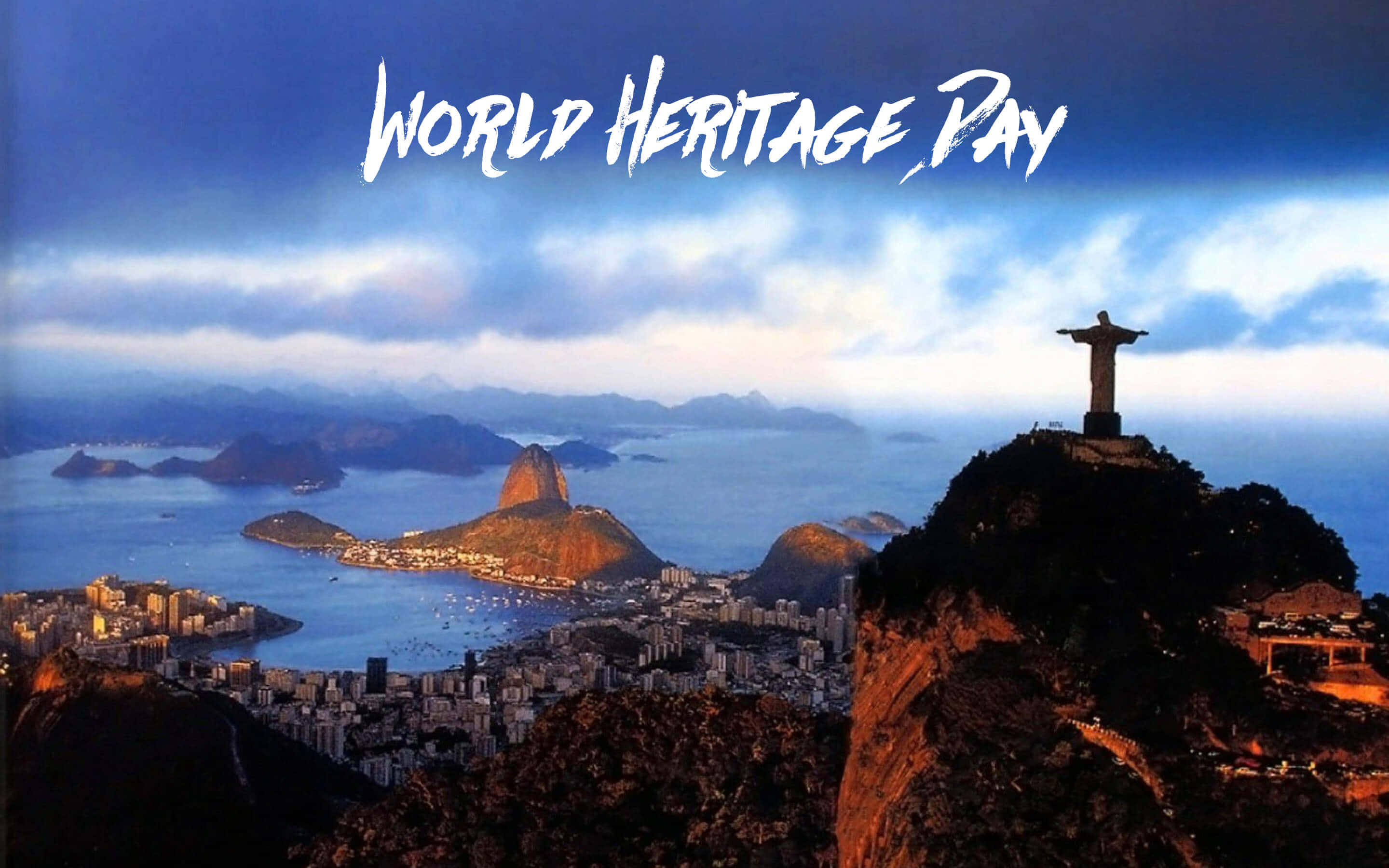 巴西 桌布 壁紙 — 基督救世主雕像在黃金時段俯瞰里約熱內盧的海岸城市景觀和糖麵包山。