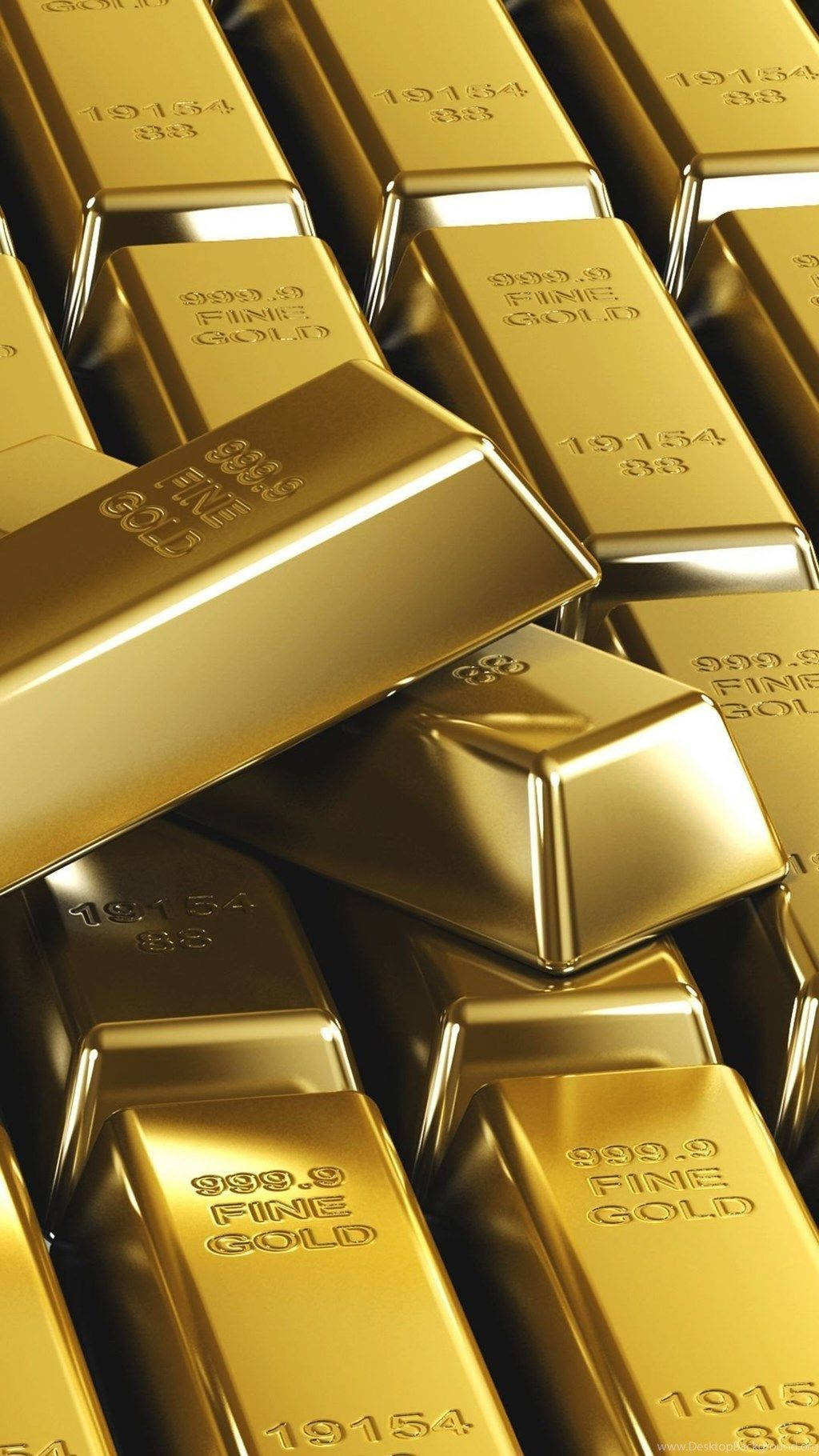 Golden 桌布 壁紙 — 堆疊閃亮金條，帶有雕刻標記，在特寫鏡頭中反射光線。